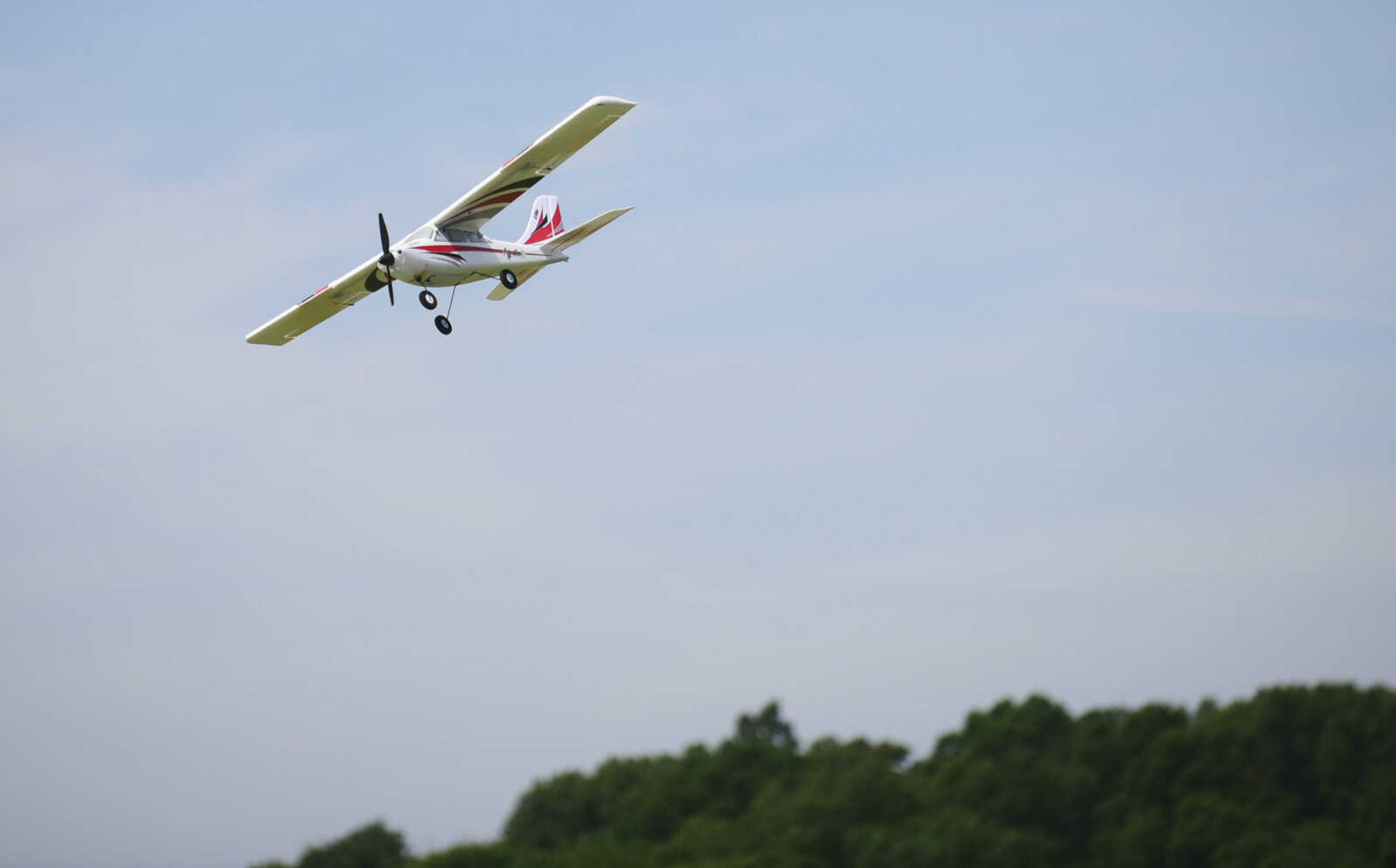 A model airplane flies through the air for the Cape Fly Hi radio controlled aircraft demonstration Saturday, June 3, 2017 at Galaxy Park in Cape Girardeau.