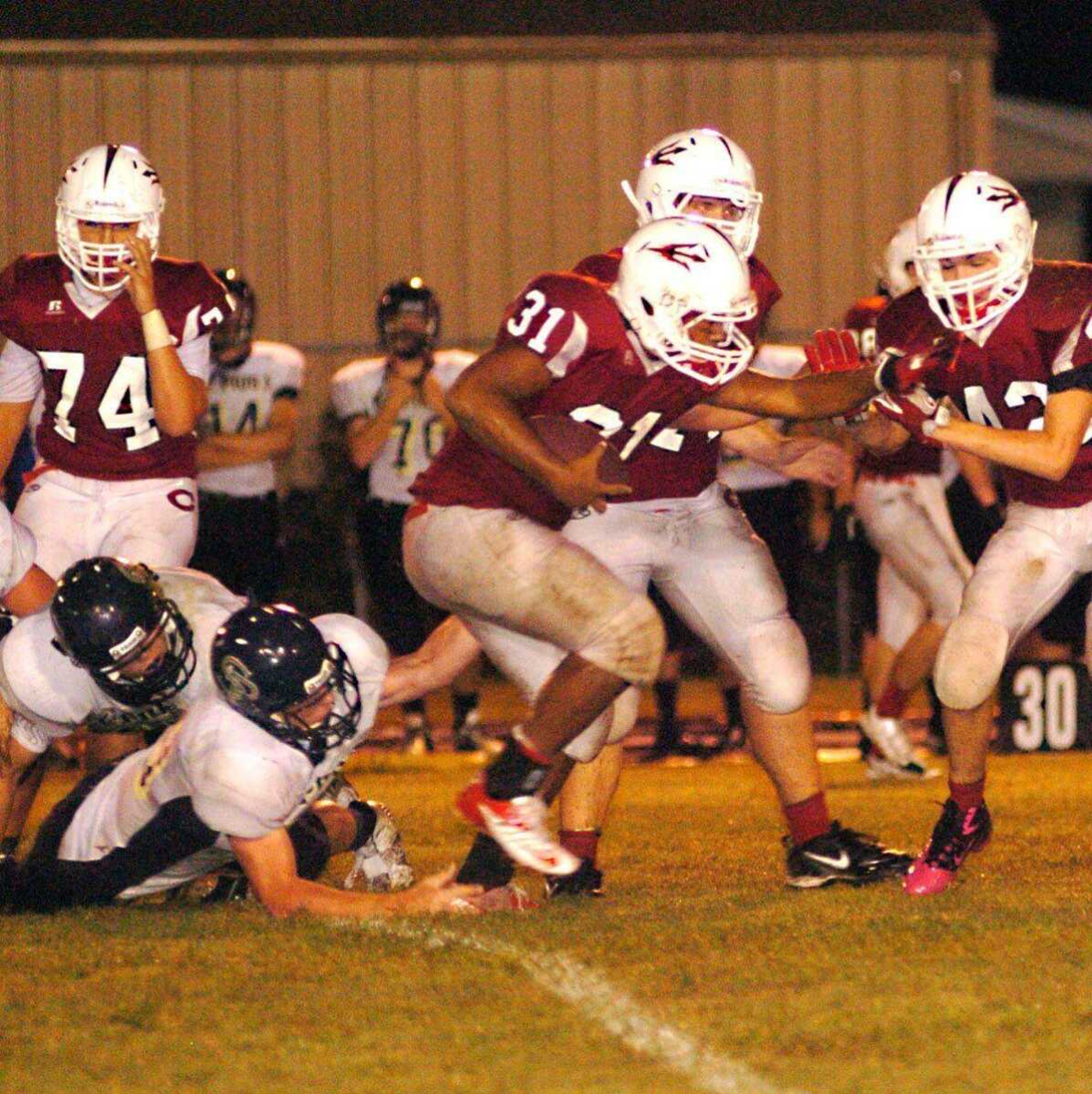 Chaffee quaterback Jimmy Golden evades a St. Pius defender.