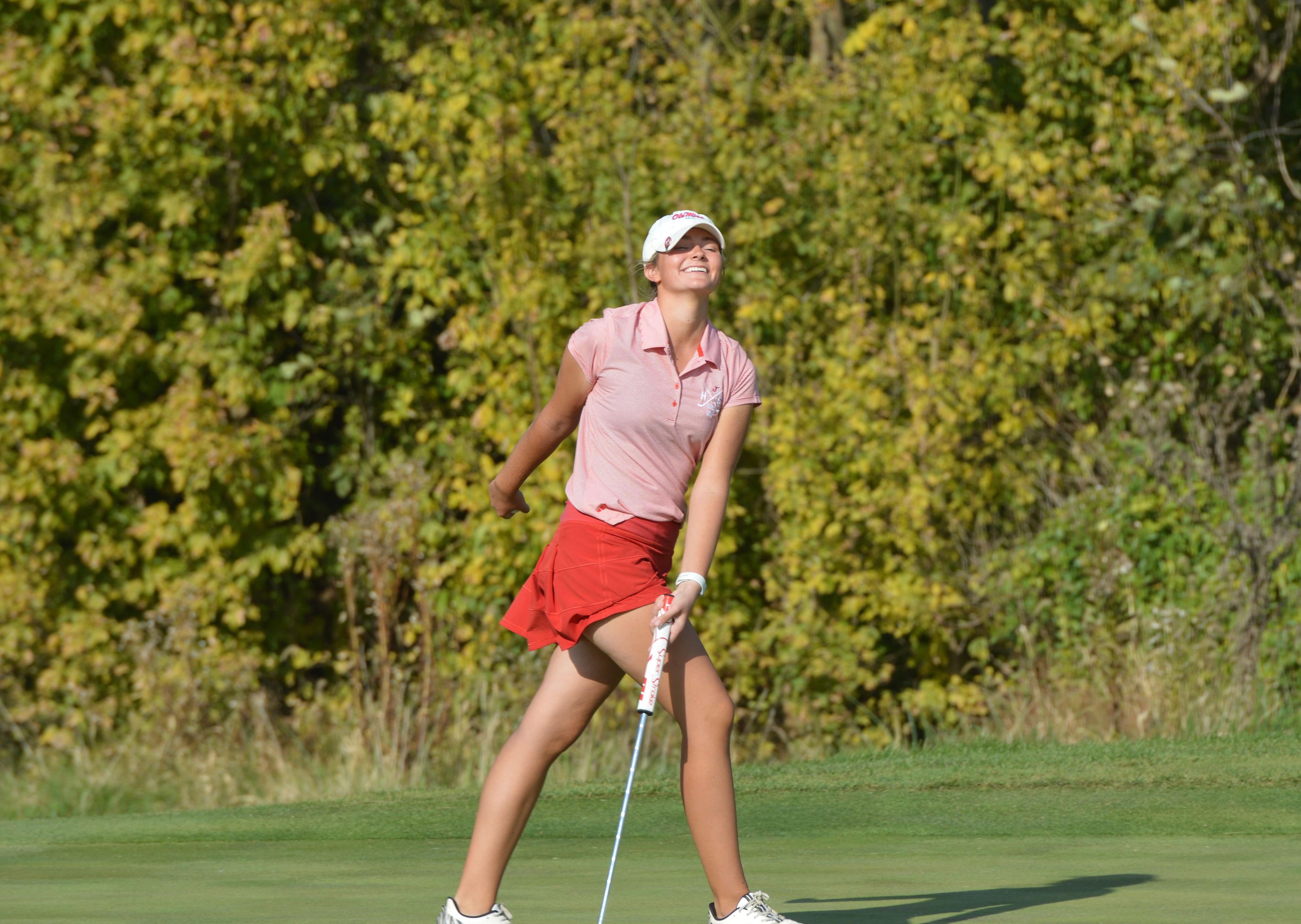 Jackson's Julia Schlitt smiles at her fans and family following a birdie on the final 18th hole at the Class 4 State Girls Golf Championships on Tuesday, Oct. 22.