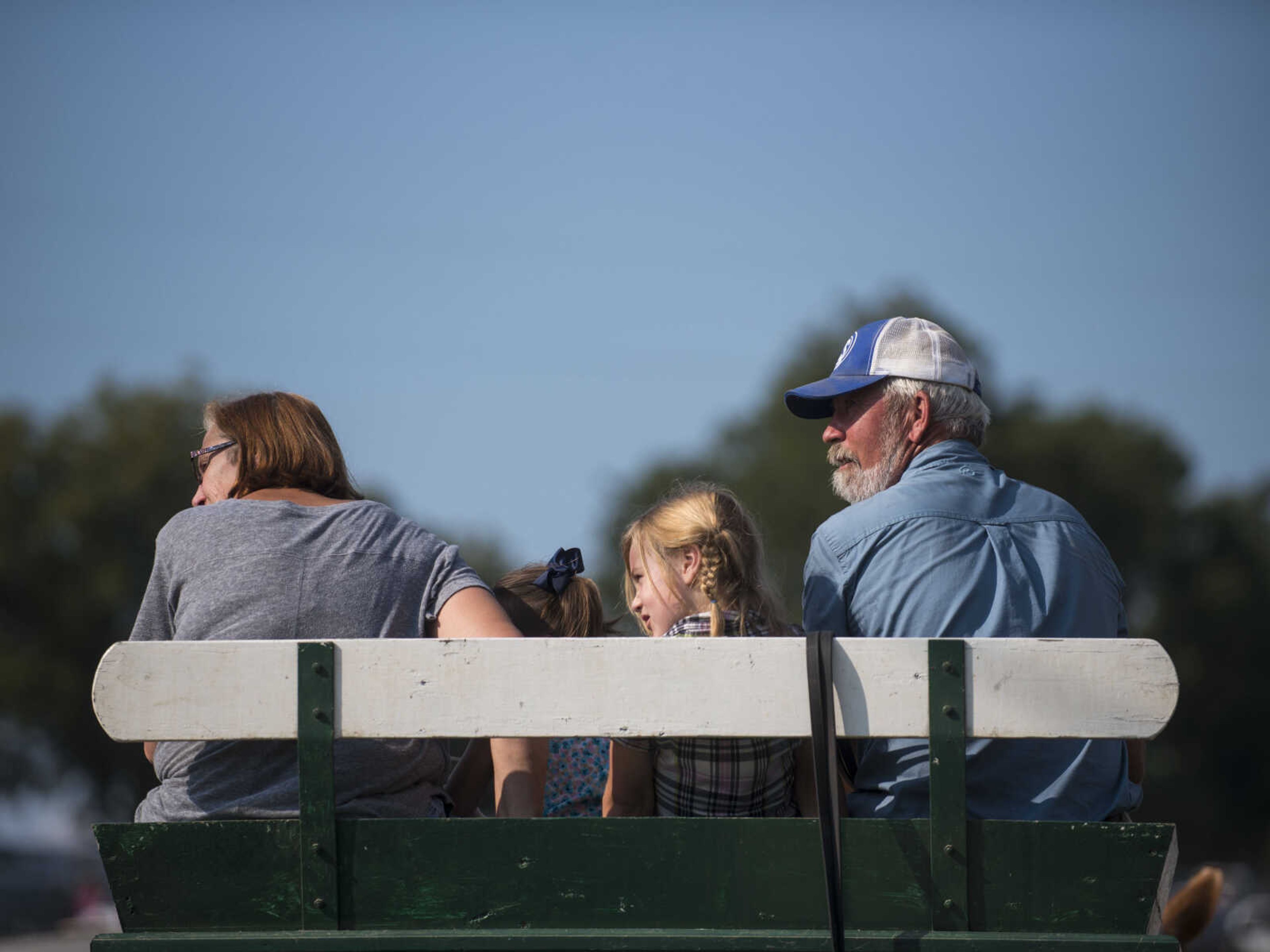 Teresa and Steve Meier sit in a carriage with their granddaughters Sept. 23, 2017 at the East Perry Community Fair in Altenburg, Missouri.