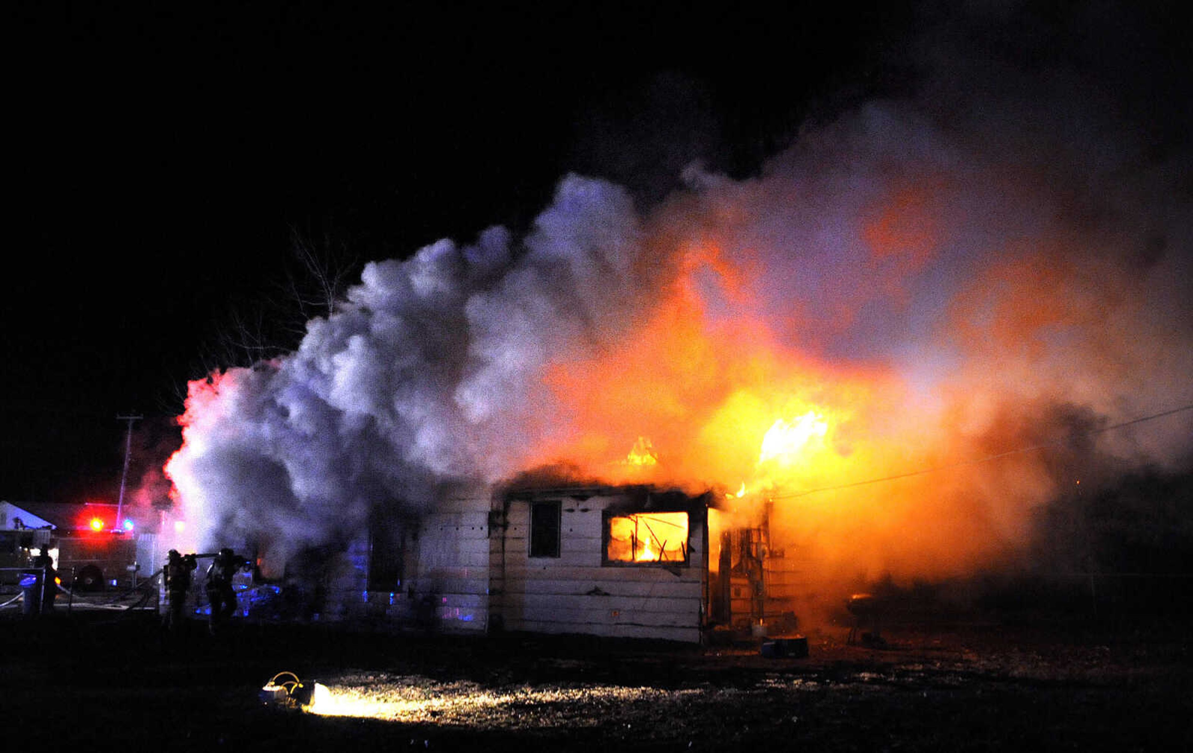 LAURA SIMON ~ lsimon@semissourian.com

Members of the Scott City and Cape Girardeau fire departments battle a blaze at 308 W. Missouri Blvd. in Scott City, Wednesday, Dec. 18, 2013. Nobody was injured in the fire.