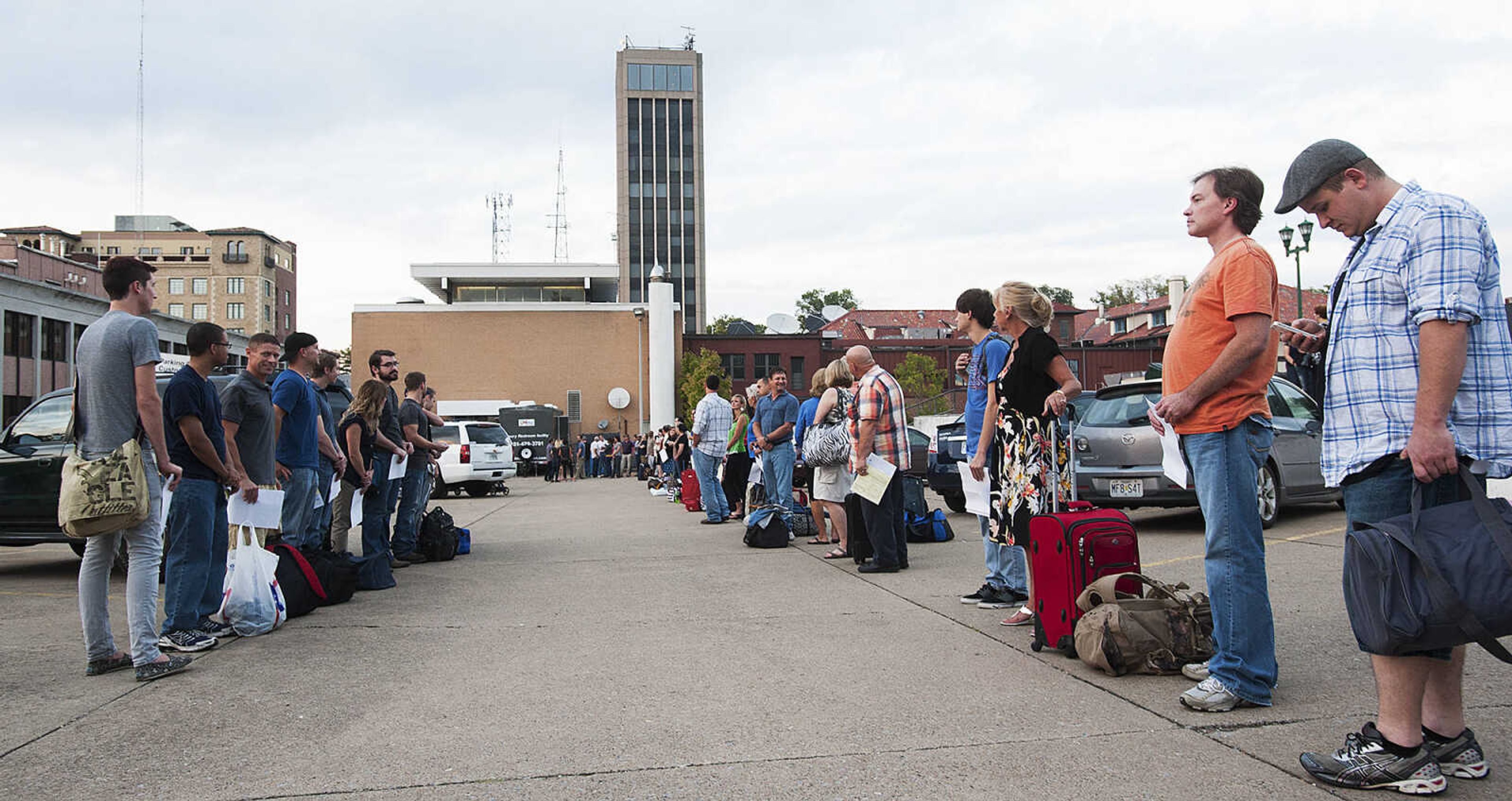 ADAM VOGLER ~ avogler@semissourian.com
Extras working on the 20th Century Fox feature film "Gone Girl," receive instructions from a  member of the crew before filming a sceneThursday, Oct. 3, in downtown Cape Girardeau.