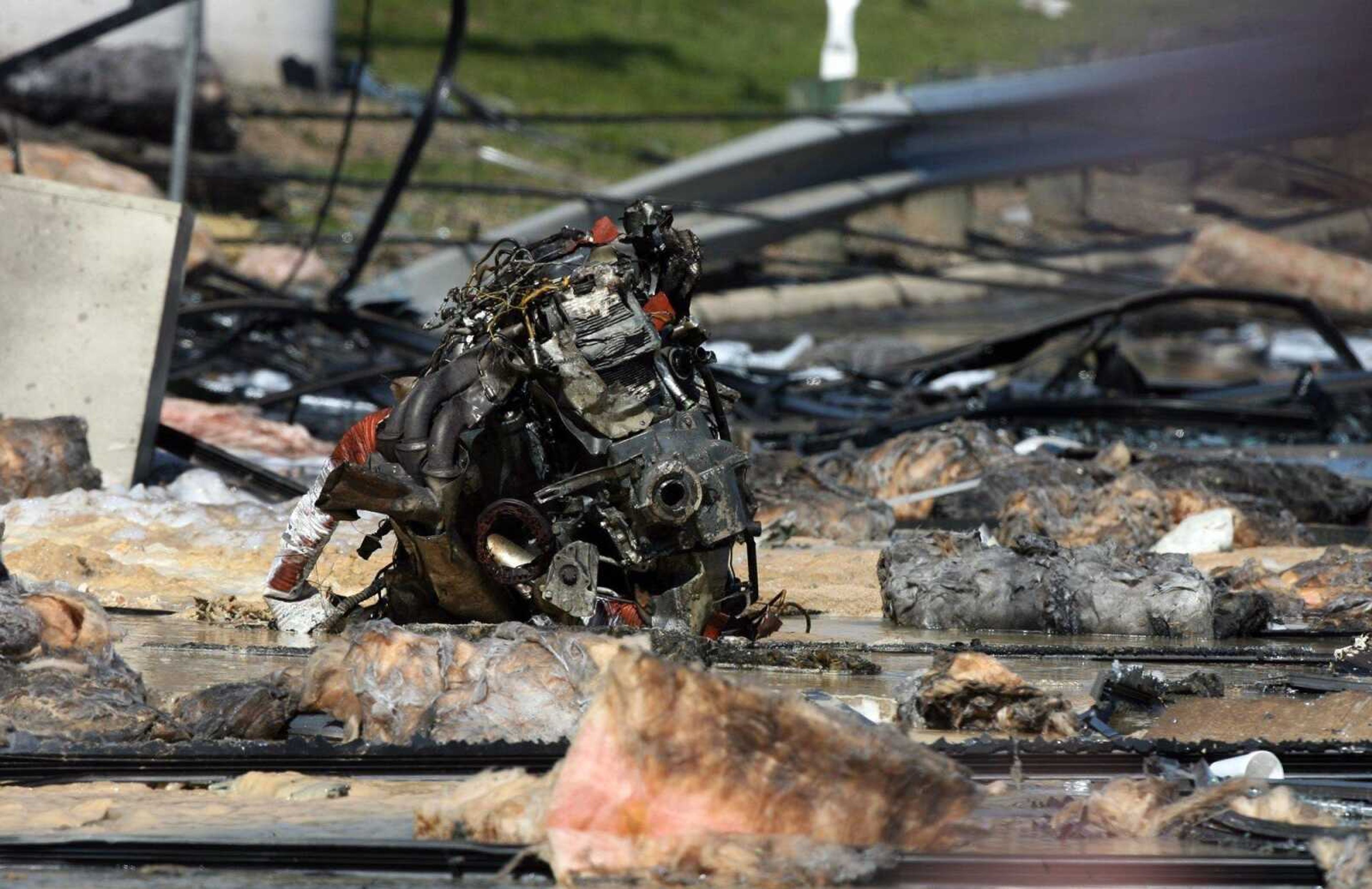 Debris is seen at  the scene where a small private plane crashed into a building that houses an office of the federal tax agency in Austin, Texas on Thursday Feb. 18, 2010. (AP Photo/Austin American-Statesman, Rodolfo Gonzalez)