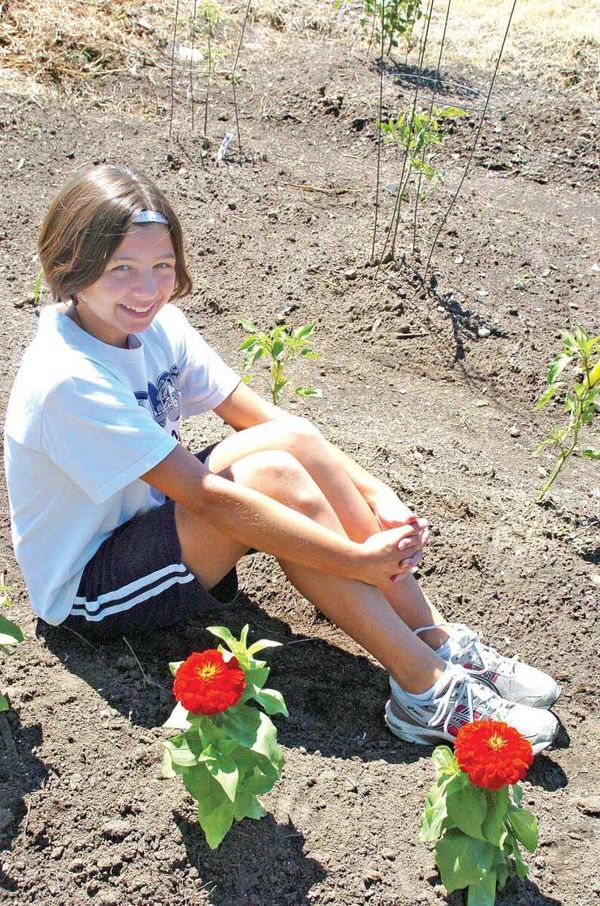 Students share garden vegetables with homebound parish members