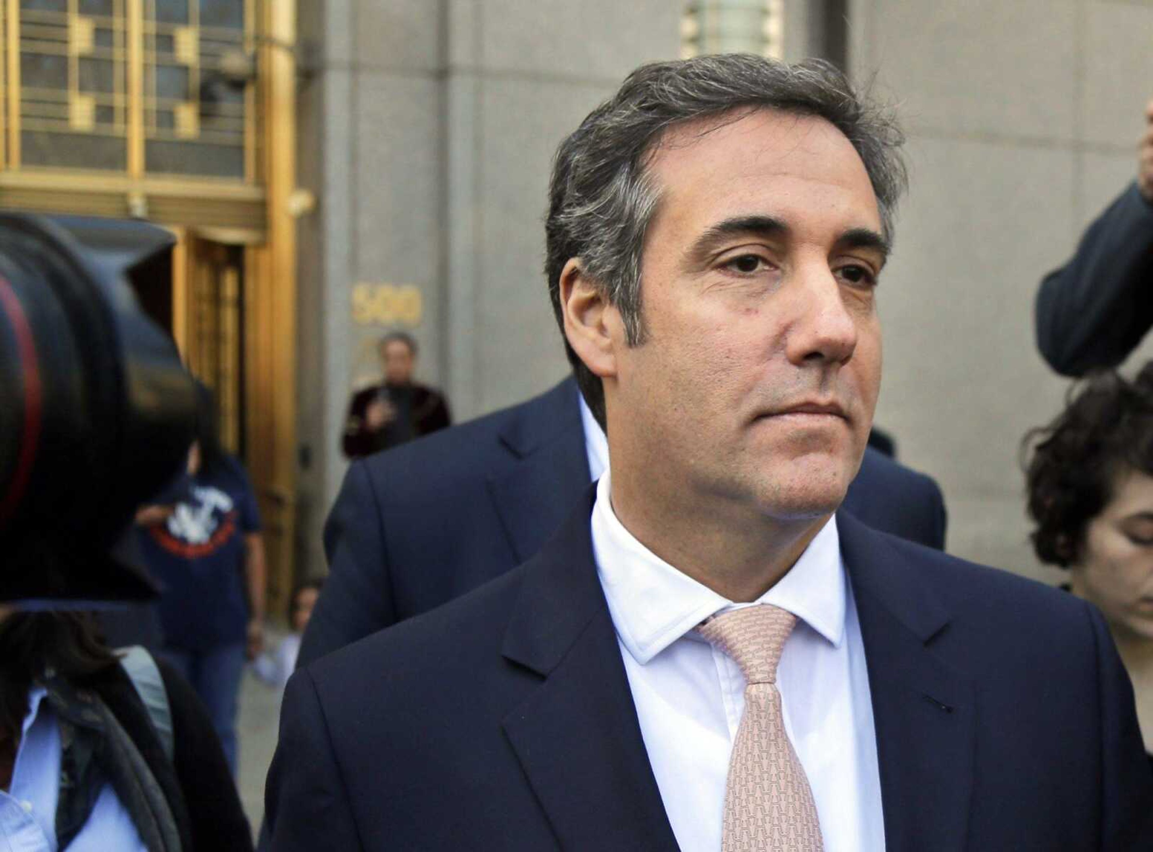 Michael Cohen leaves federal court in New York after an April hearing. President Donald Trump's former personal lawyer secretly recorded Trump discussing payments to a former Playboy model who said she had an affair with him, The New York Times reported Friday.