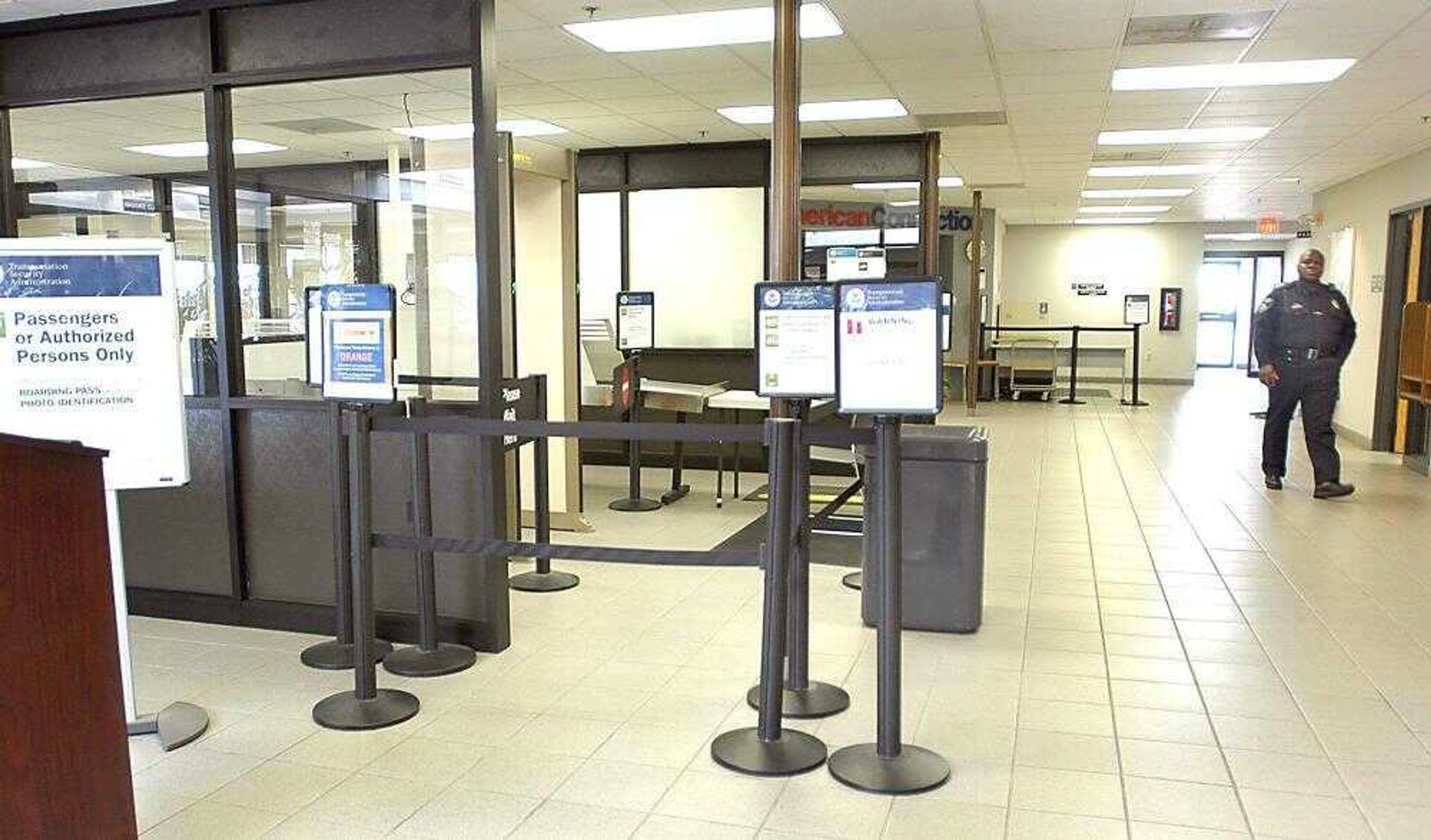 A security guard walked through the empty airport Friday after RegionsAir Inc. shut down all flights in and out of Cape Girardeau Regional Airport. (Diane L. Wilson)