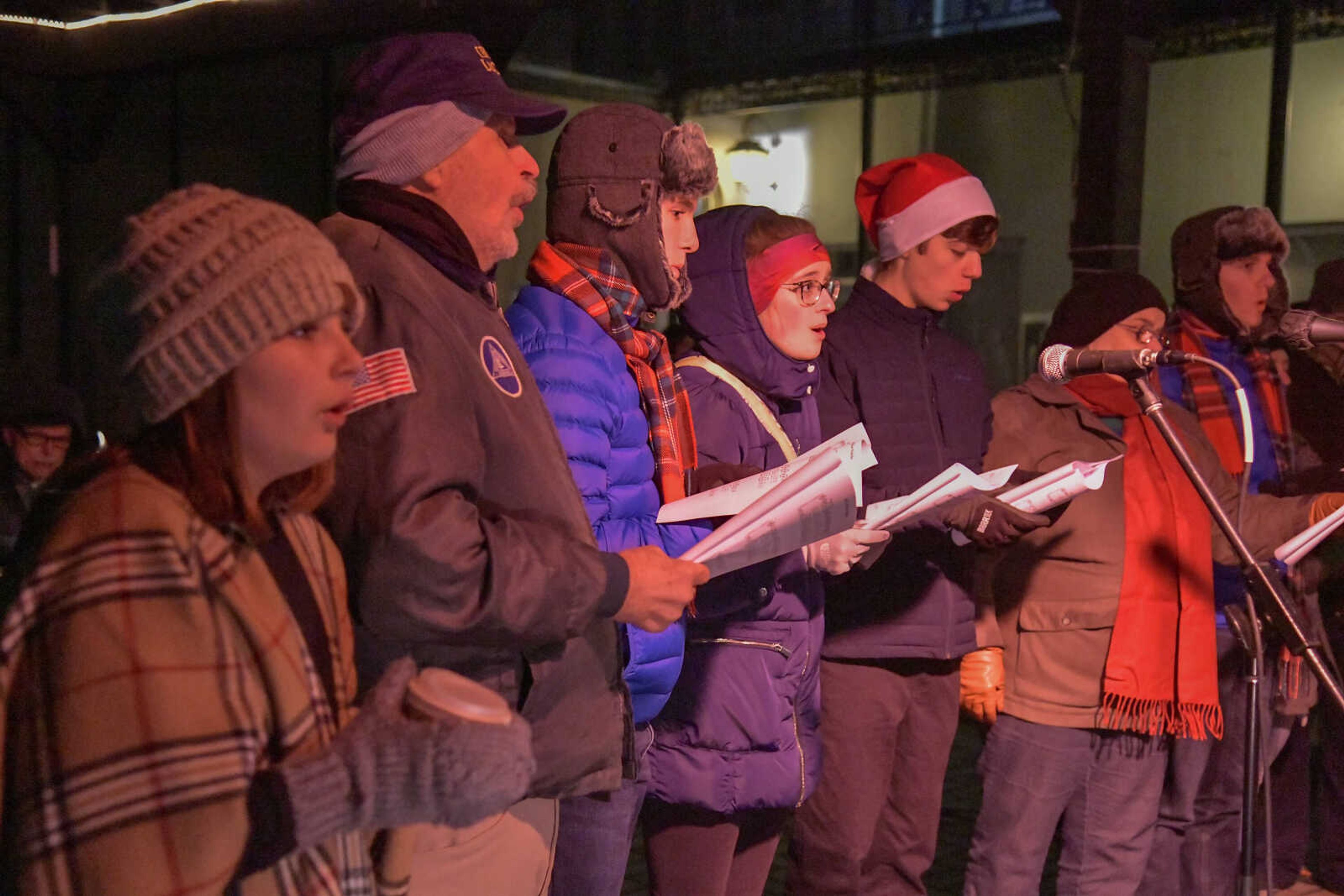 Christmas carolers perform Christmas songs during the 3rd Annual Old Town Cape Christmas Tree Lighting on Friday in Cape Girardeau.