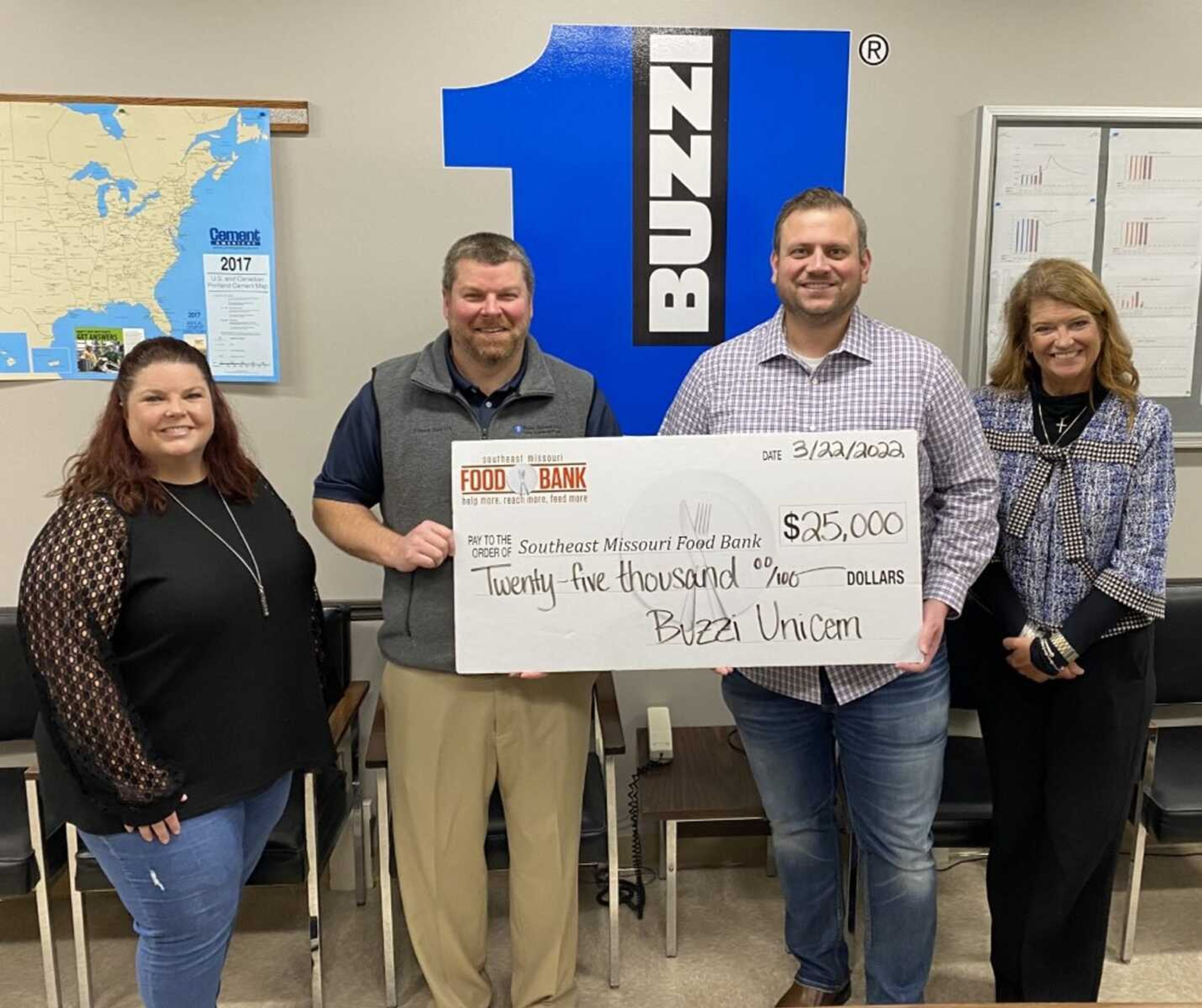 Maureen Tokar, far left, and Craig Conklin of Buzzi Unicem present the company's donation recently to SEMO Food Bank's Joey Keys and Sarah Garner, pictured at right.