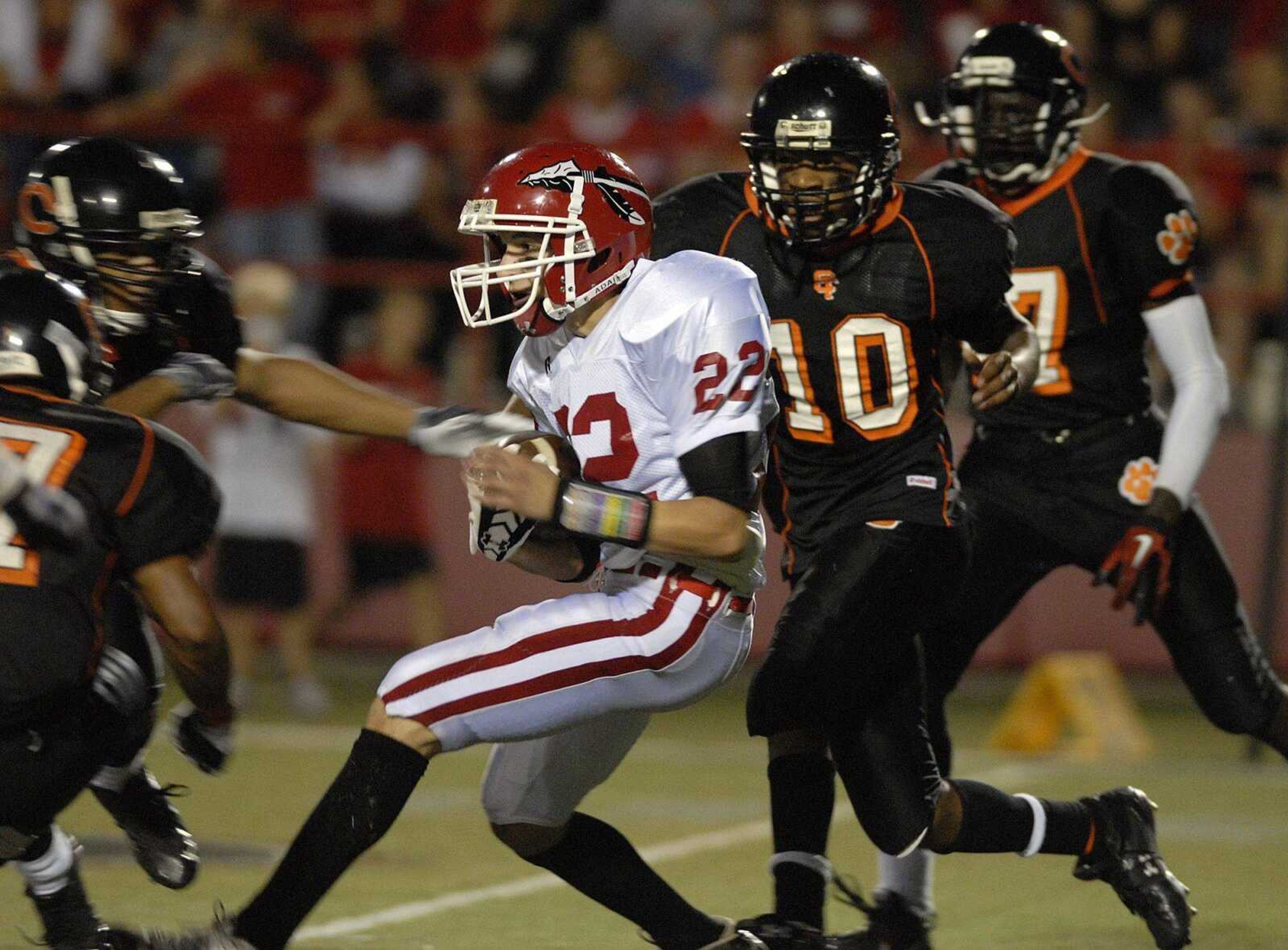 Central defenders surround Jackson's Brandon Wright during Friday's game at Houck Stadium. (Laura Simon)