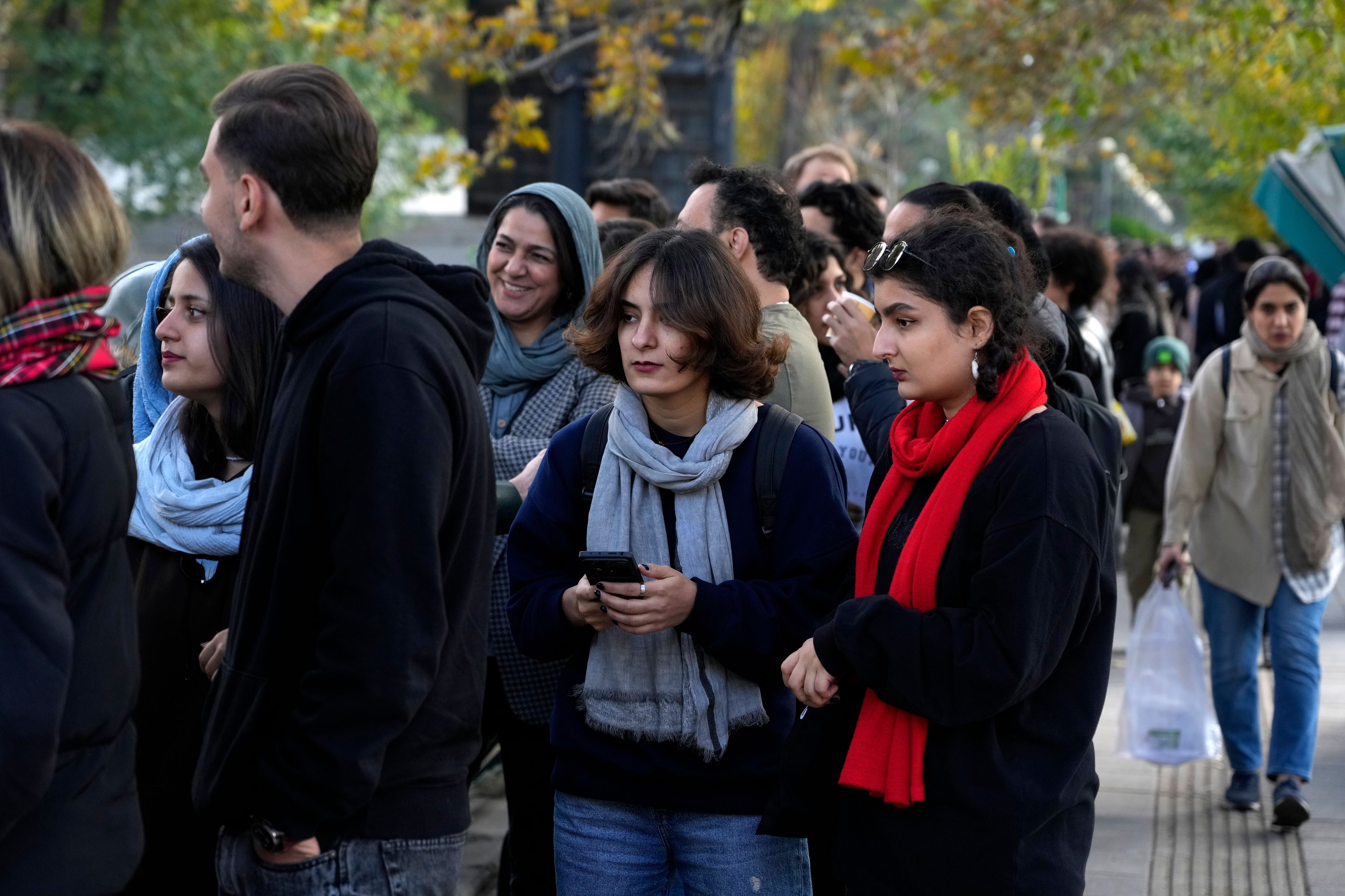 Iranians line up to visit an exhibition titled Eye to Eye which showcases over 120 works by modern world artists as well as Iranian painters at Tehran Museum of Contemporary Art, in Tehran, Thursday, Nov. 21, 2024. (AP Photo/Vahid Salemi)