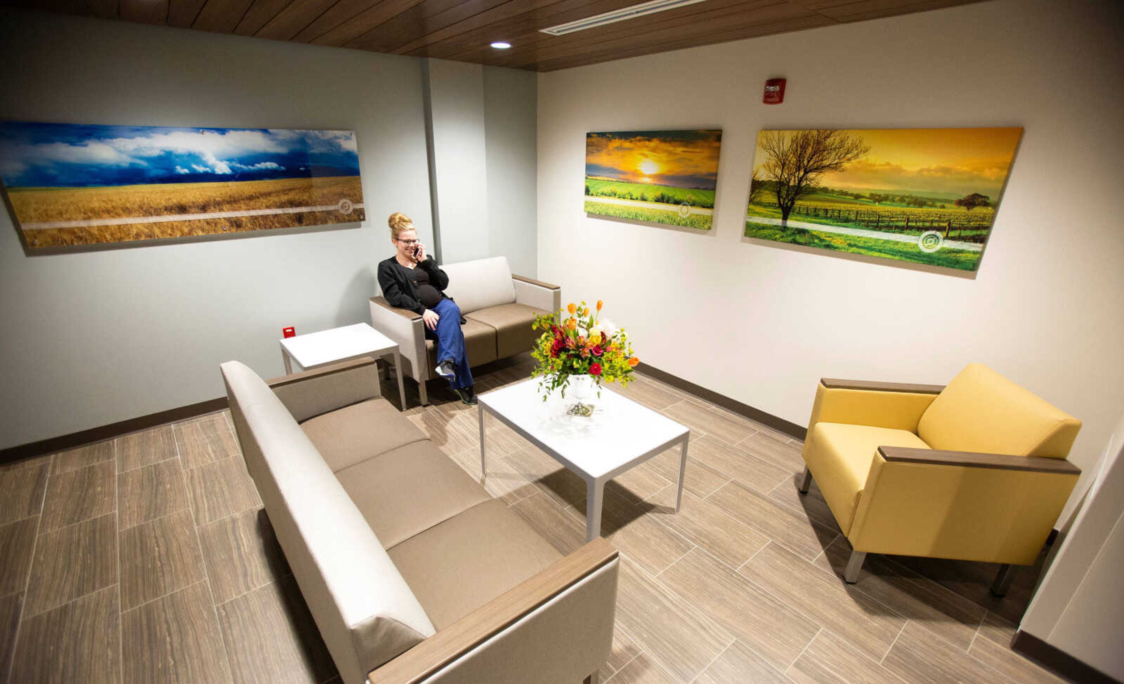 A comfortable gathering area greets visitors as they step off the elevator.