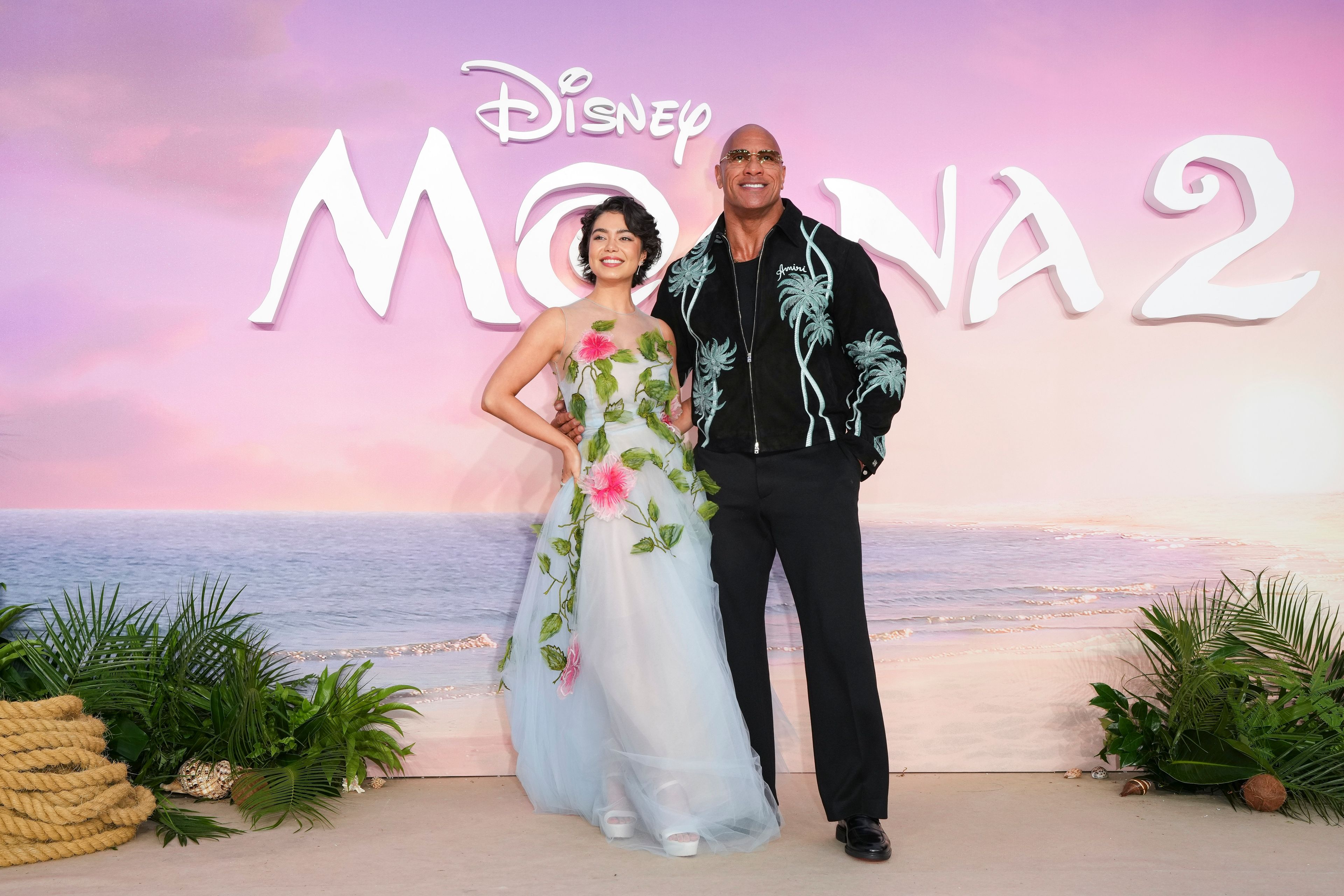 Auli'i Cravalho, left and Dwayne Johnson pose for photographers upon arrival at the UK premiere of Moana 2 on Sunday, Nov. 24, 2024, at a central London cinema. (Photo by Scott A Garfitt/Invision/AP)