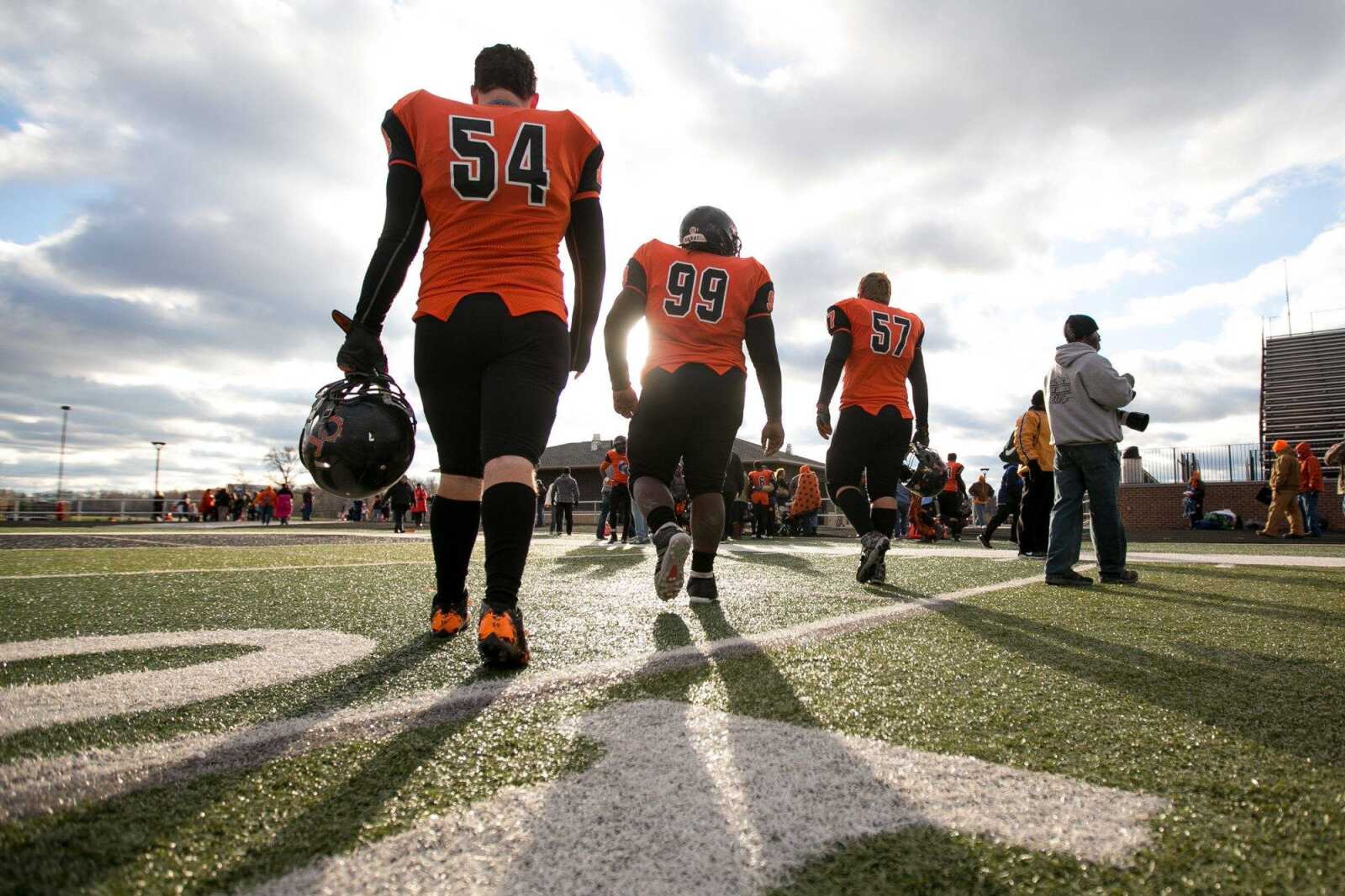 Cape Central's Colt Sweet (54), Lamarcus Johnson (99) and Hunter Limbach (57) walk off the field after their 35-14 loss against Webb City during a Class 4 semifinal Saturday, Nov. 21, 2015 at Cape Central High School.