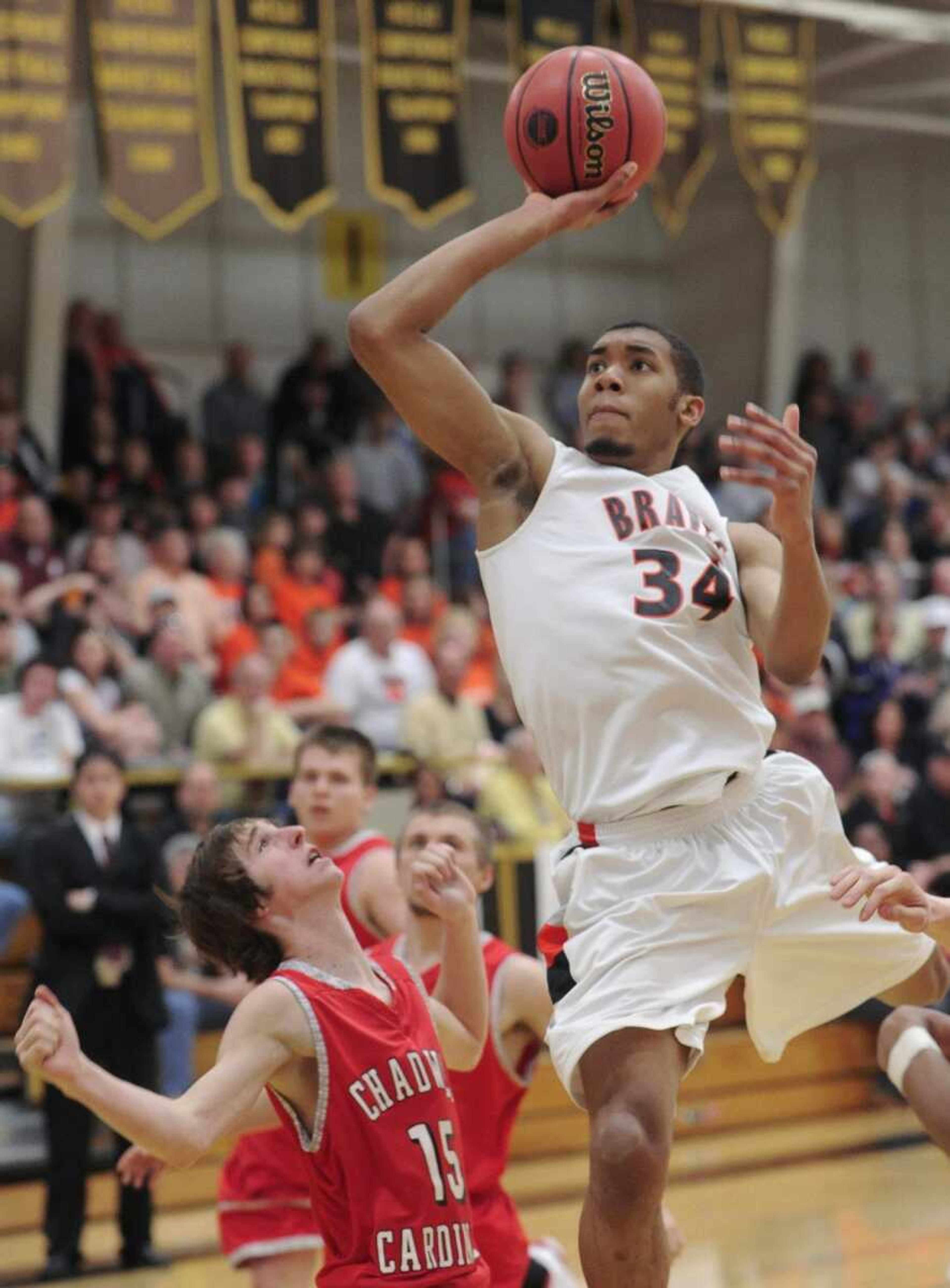 Scott County Central's Calvin Porter puts up a shot over Chadwick's Luke Johnson in the second quarter of the Class 1 quarterfinal Saturday, March 12, 2011 in Poplar Bluff, Mo. (Fred Lynch)