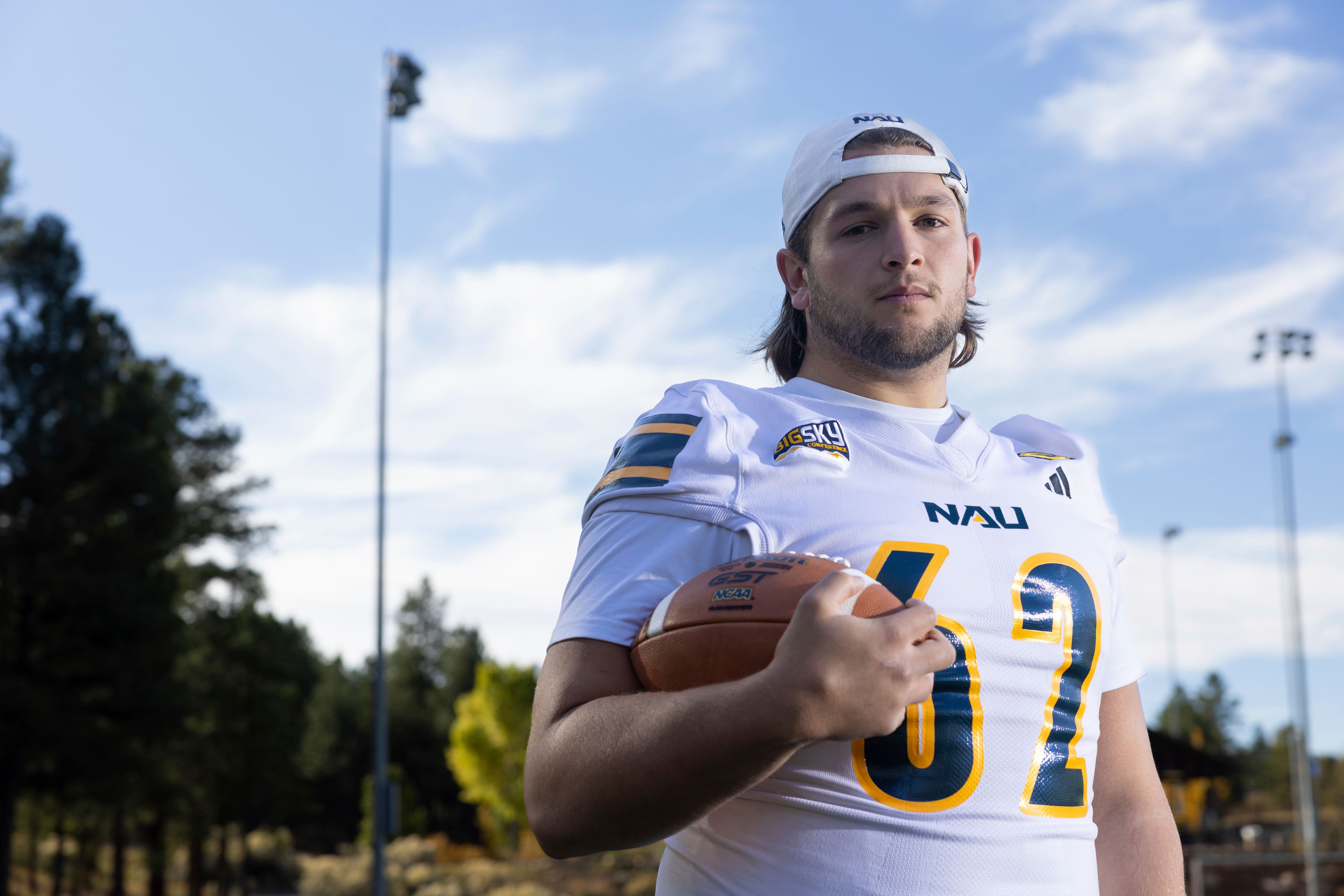 Northern Arizona University's Jonny Bottorff took advantage of new NIL money making opportunities and rebooted his college football career. Bottorff poses for a photo on the campus on NAU on Monday, Oct. 28, 2024, in Flagstaff, Ariz. (AP Photo/Josh Biggs)