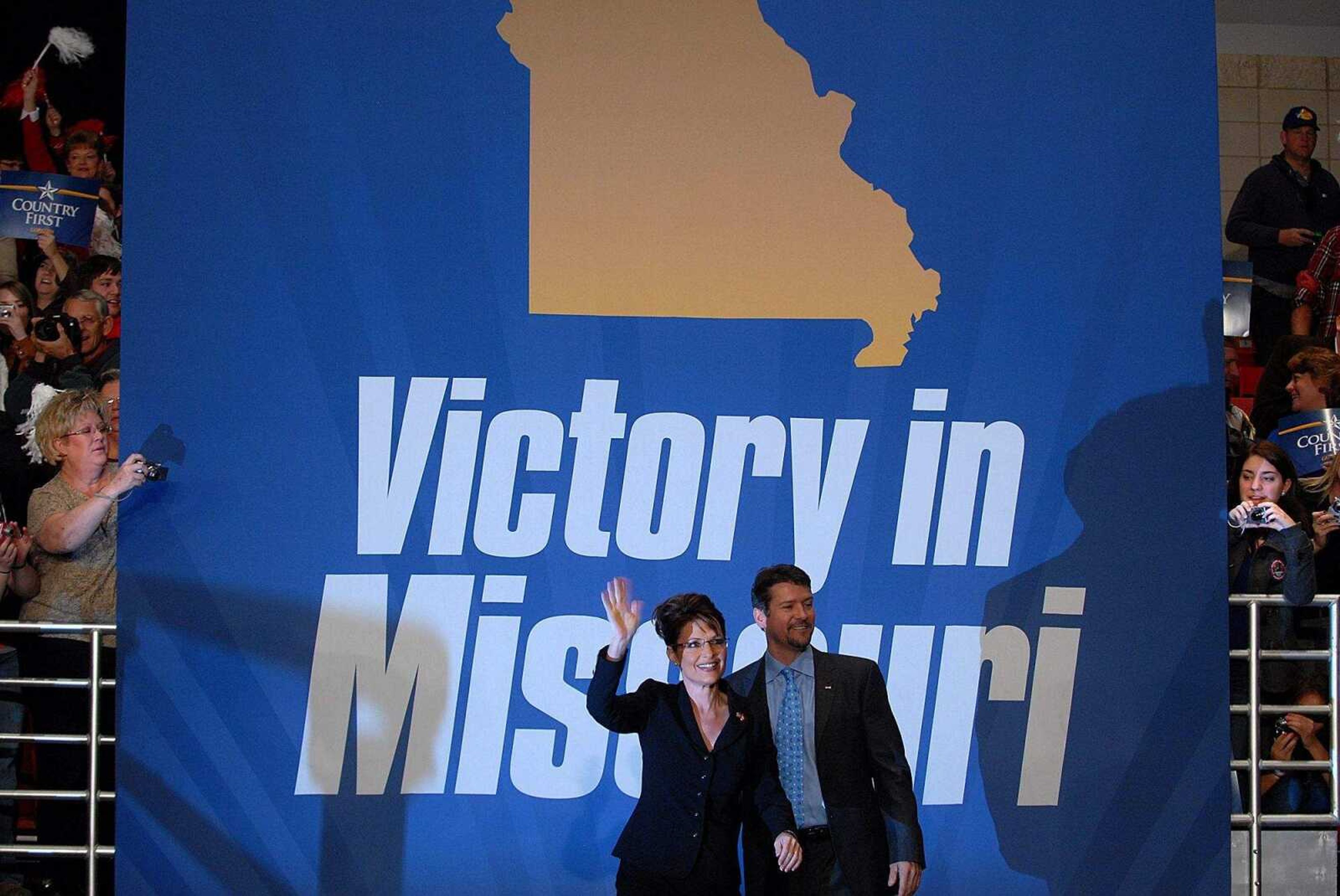 AARON EISENHAUER ~ aeisenhauer@semissourian.com
Sarah Palin, with husband Todd Palin, makes her way to the stage.