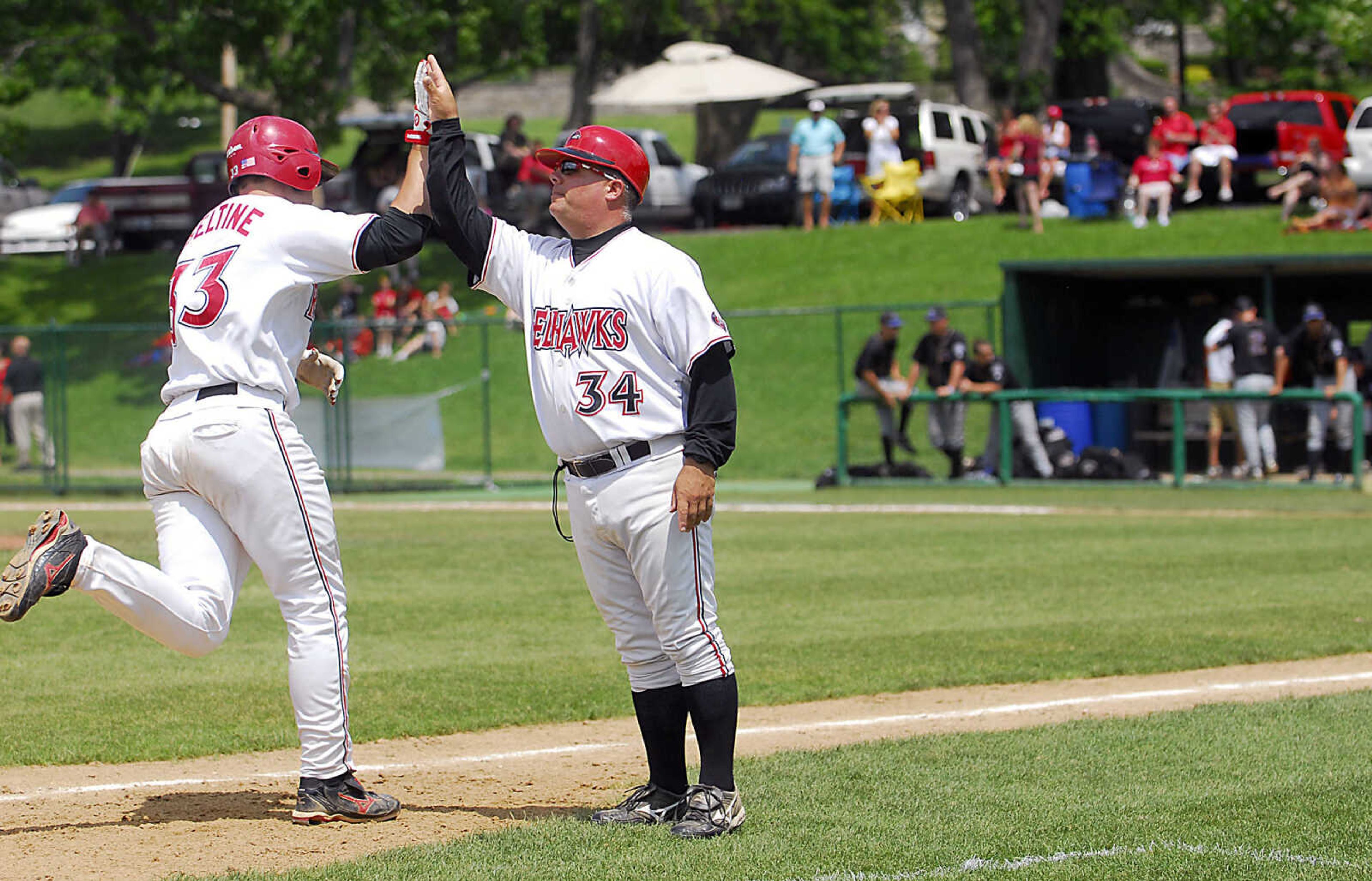 KIT DOYLE ~ kdoyle@semissourian.com
Coach Chris Cafalone congratulates Louie Haseltine on a homer Friday, May 15, 2009, at Capaha Field.