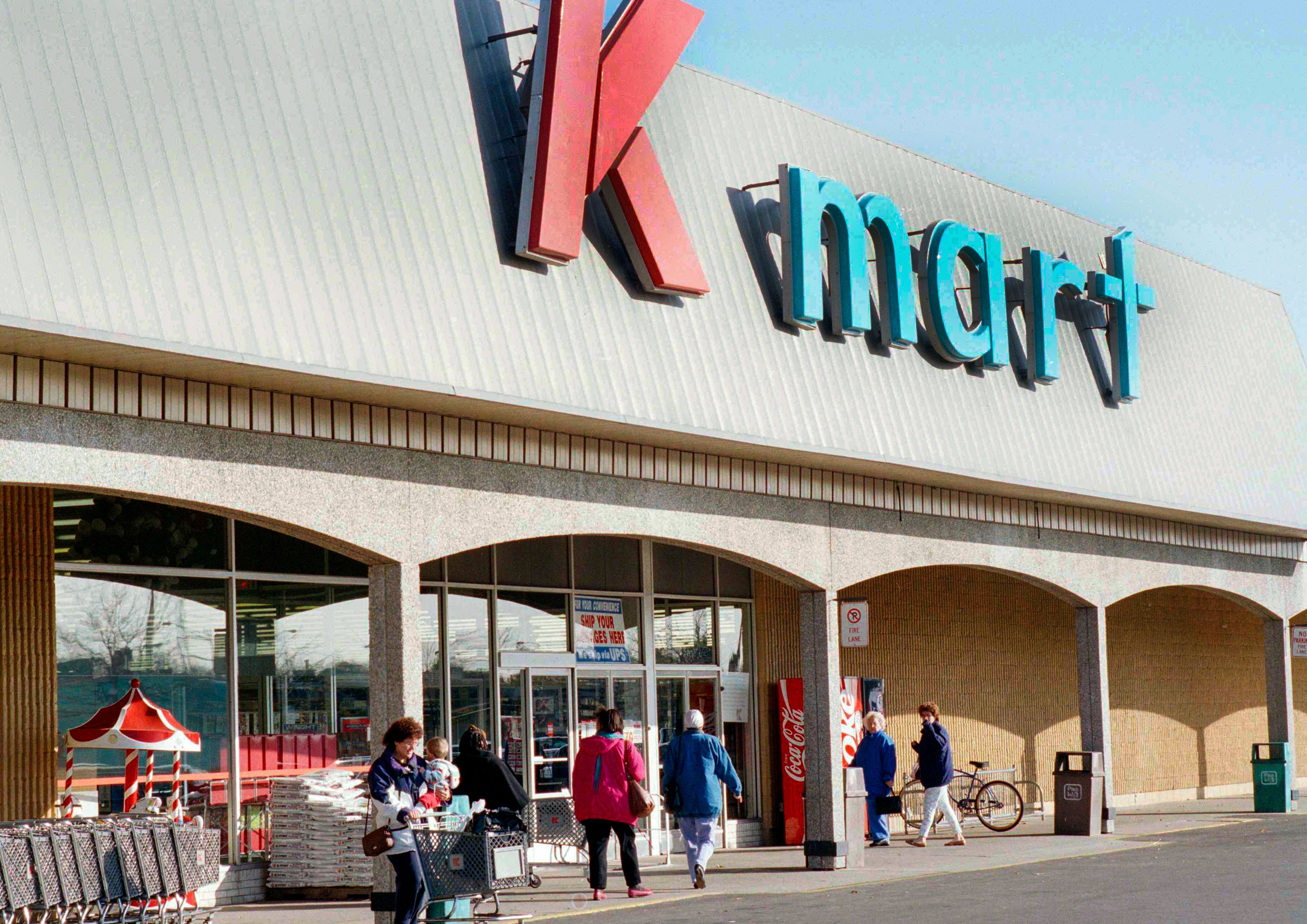 FILE - Kmart shoppers enter and leave the first Kmart ever built in Garden City, Mich., store, on Nov. 12, 1993. (AP Photo/Richard Sheinwald)