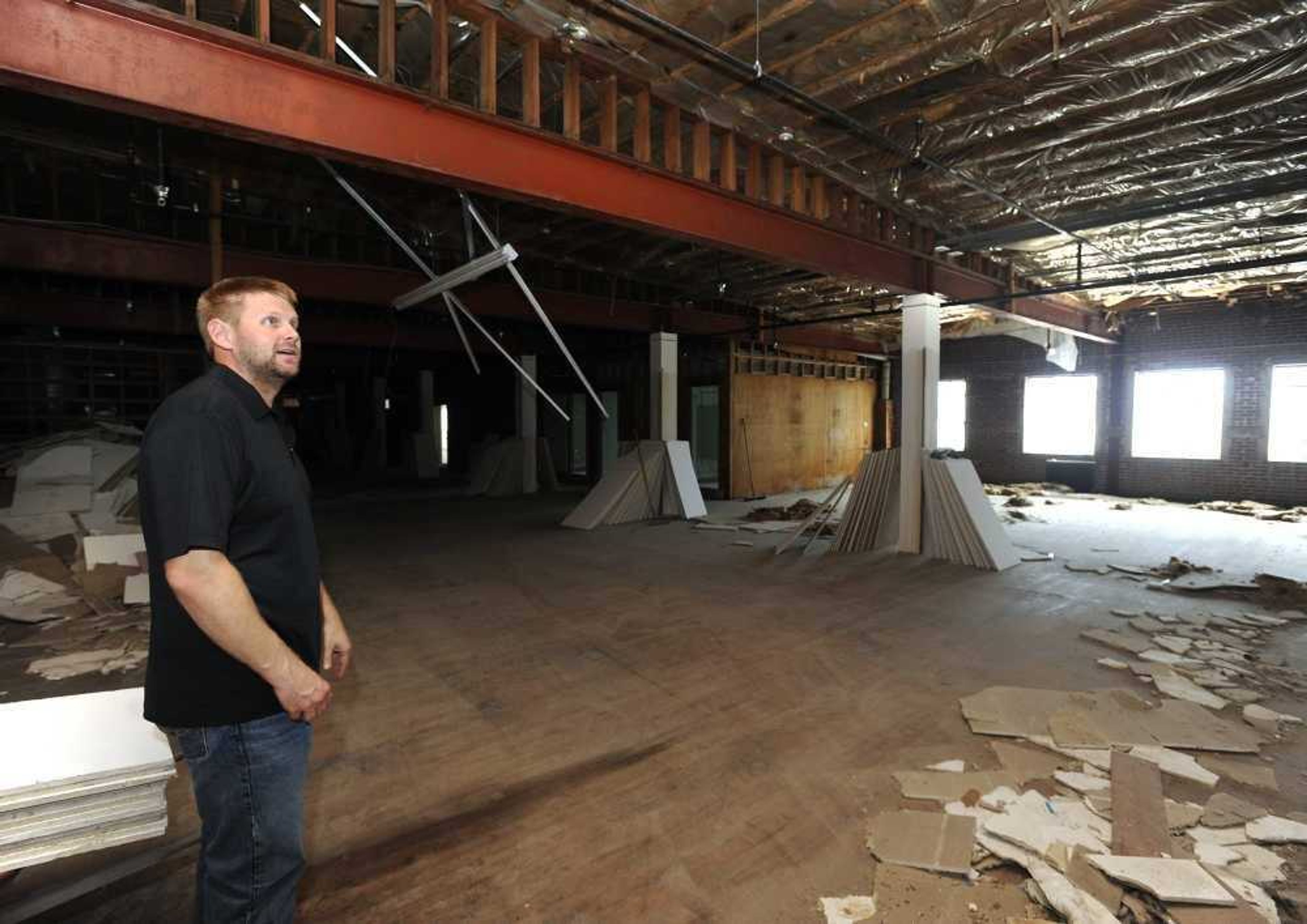 Dustin Richardson of Centurion Development LLC in 2016 shows the upstairs area of the old F.W. Woolworth Co. building at 1 N. Main St. in downtown Cape Girardeau.