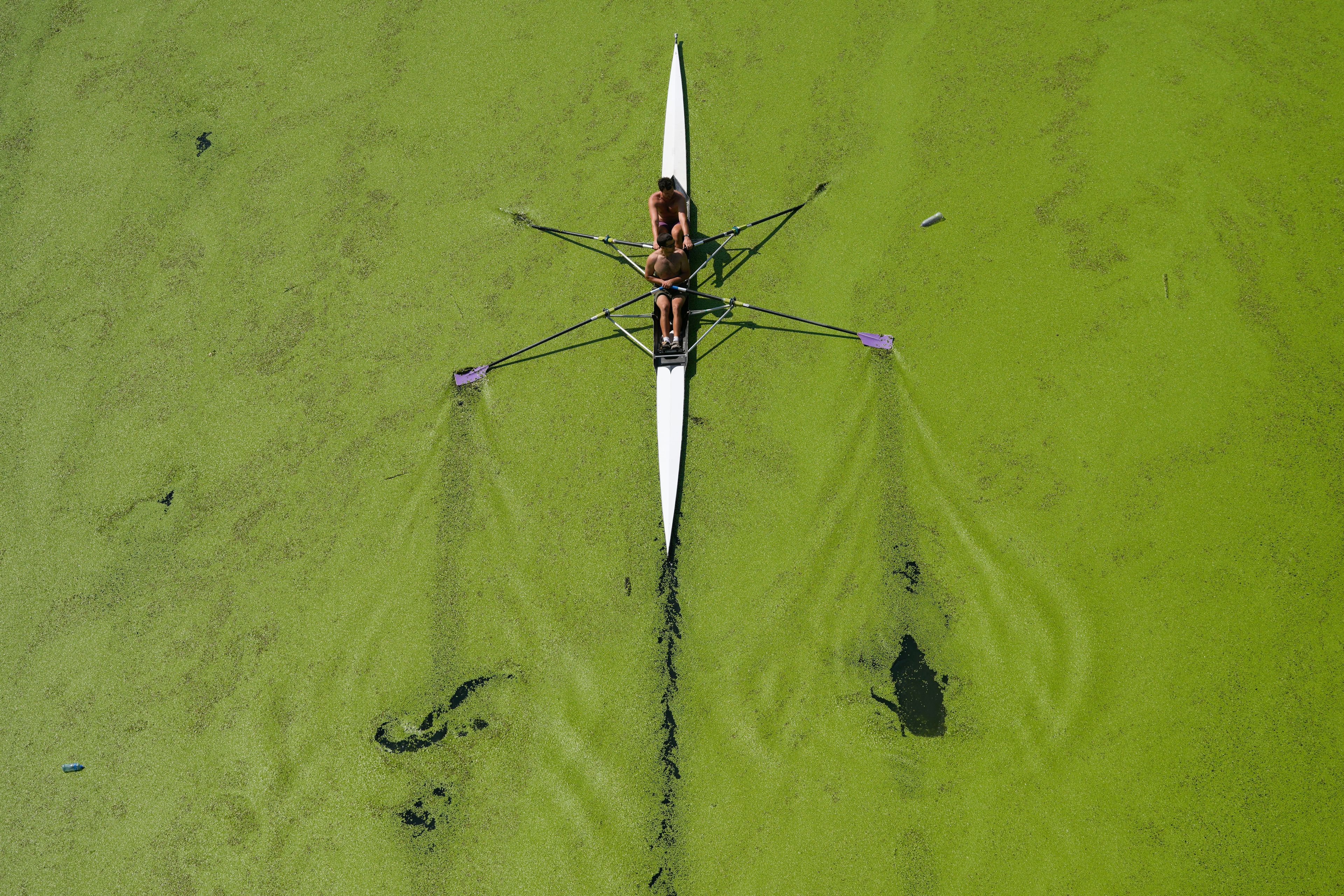 Boys row on the Sava River in Belgrade, Serbia, Sunday, Sept. 1, 2024. (AP Photo/Darko Vojinovic)