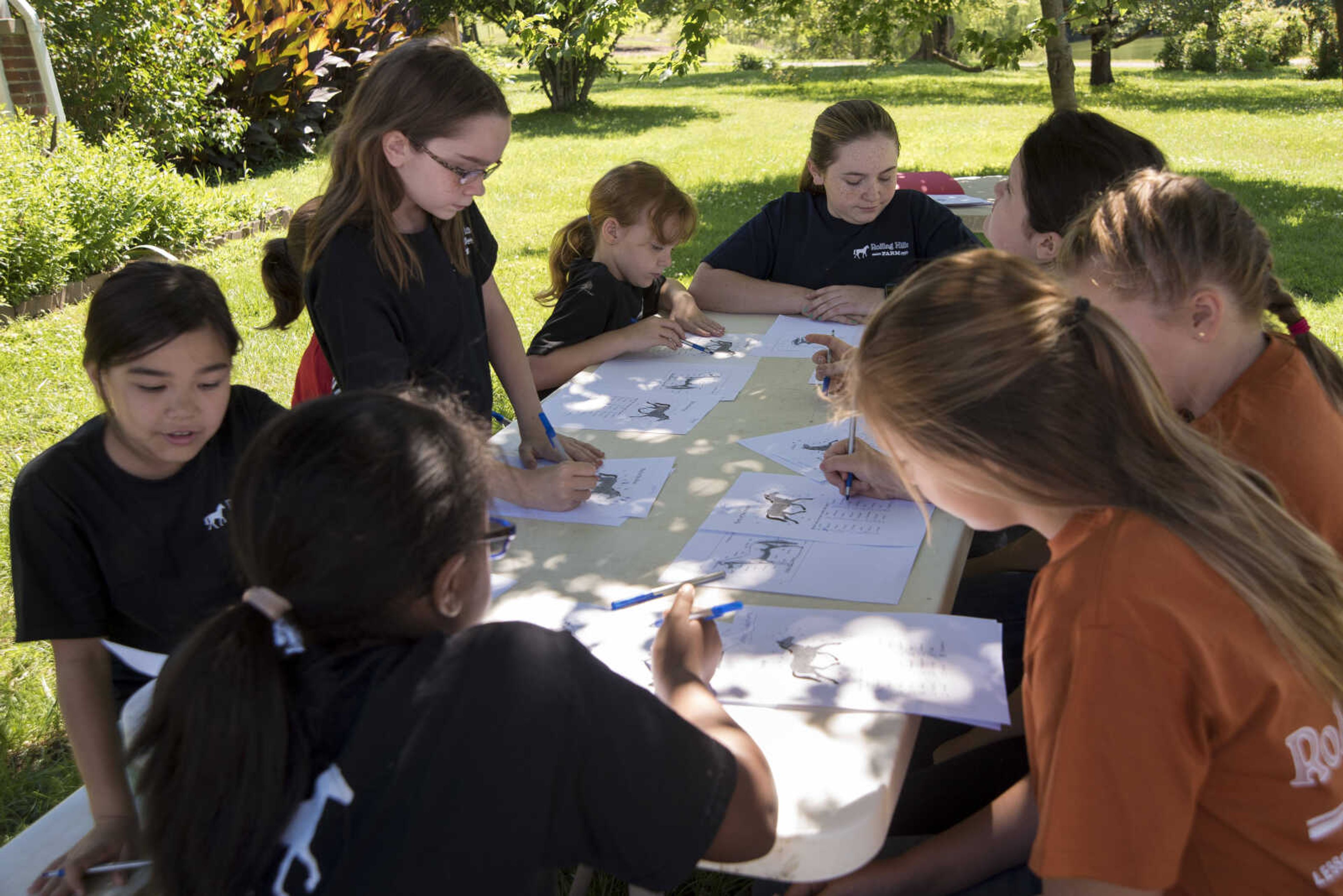 Campers fill out worksheets during the Rolling Hills Youth Day Camp Wednesday, June 7, 2017 in Cape Girardeau.