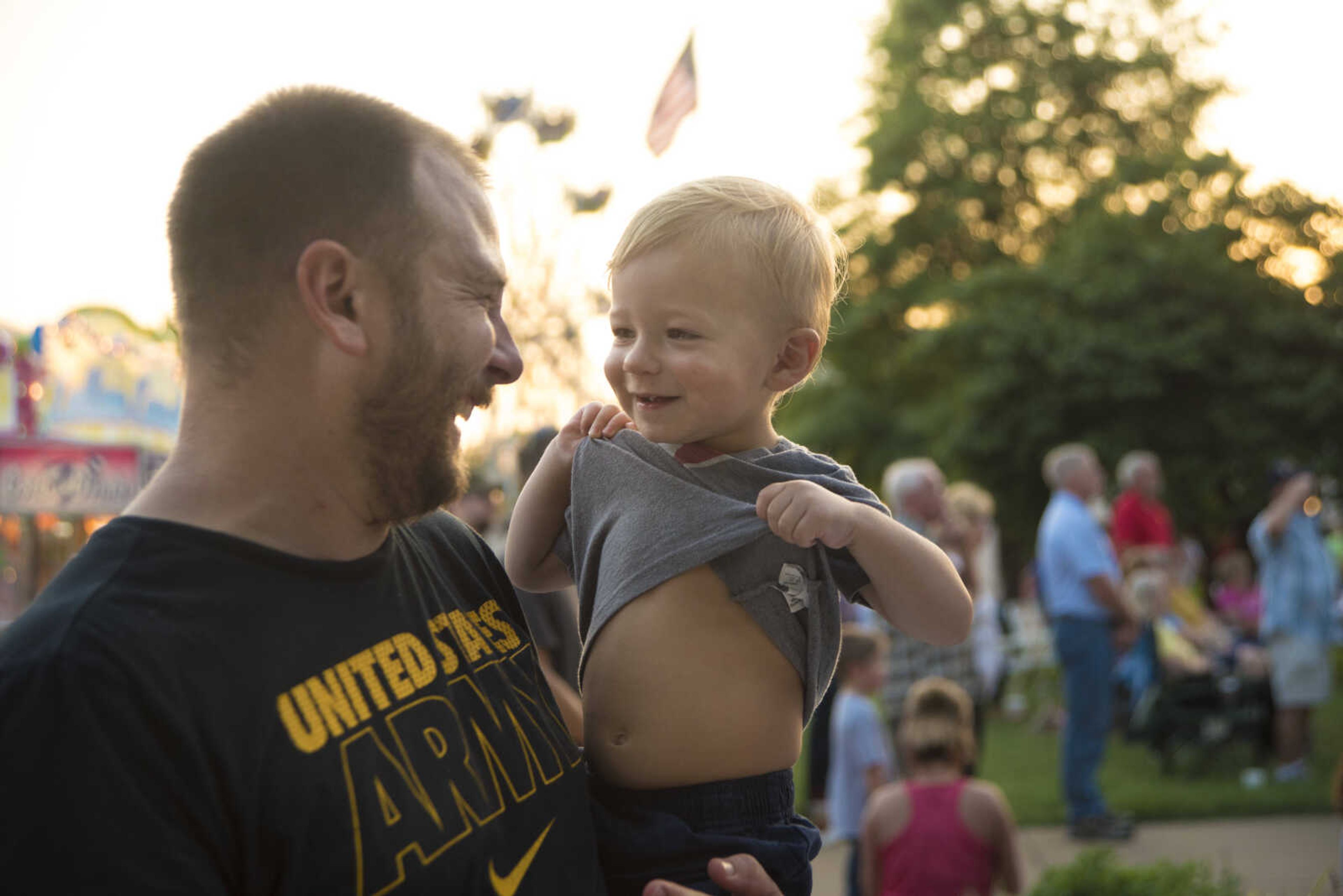 Daniel Forester laughs with his son Emmett 19 months old at the Jackson Homecomers Tuesday, July 25, 2017 in Uptown Jackson.