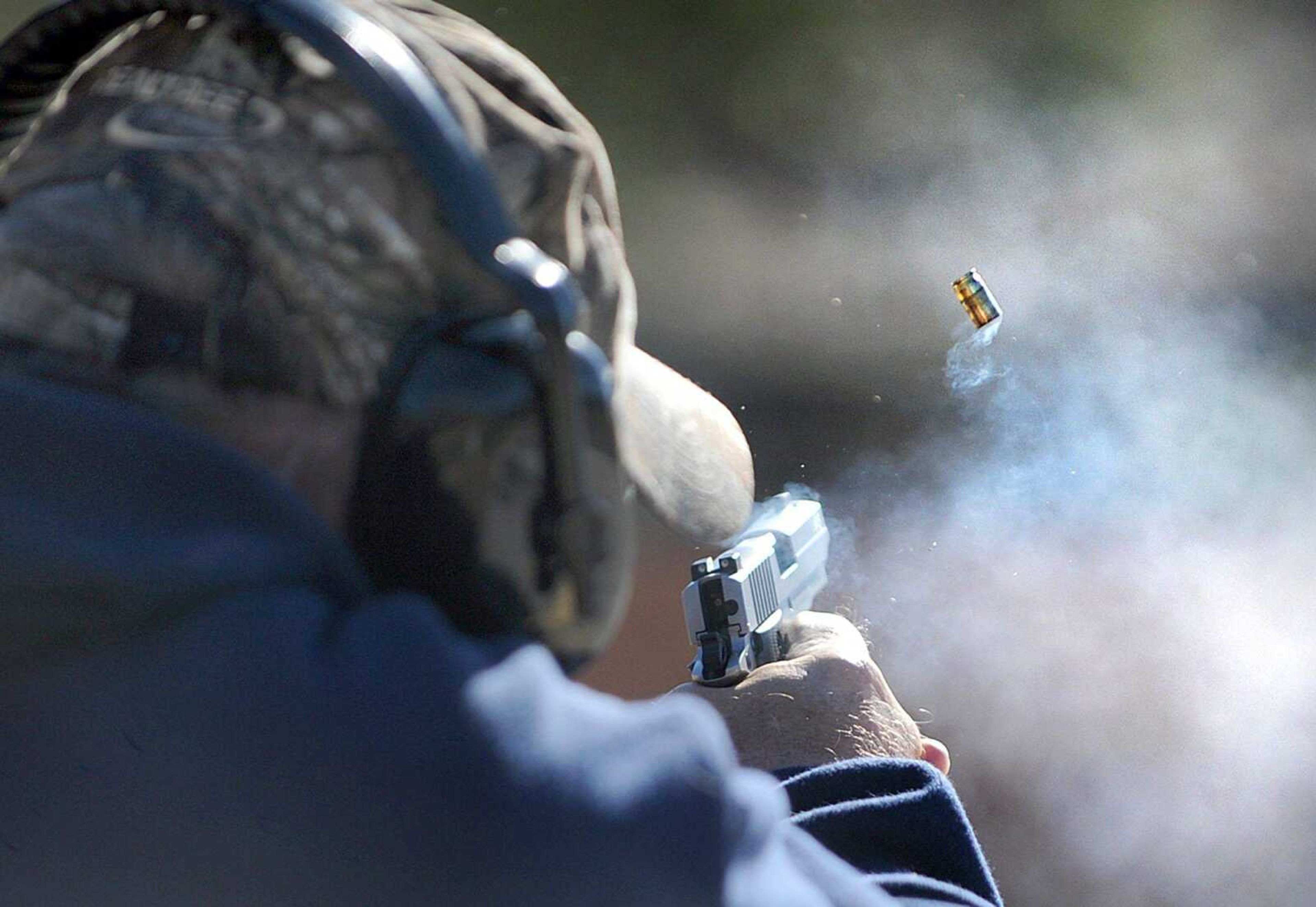 A man fires off a round from his Sig Sauer .380 on Wednesday afternoon at the Missouri Department of Conservation&#8217;s Apple Creek shooting range. (Laura Simon)