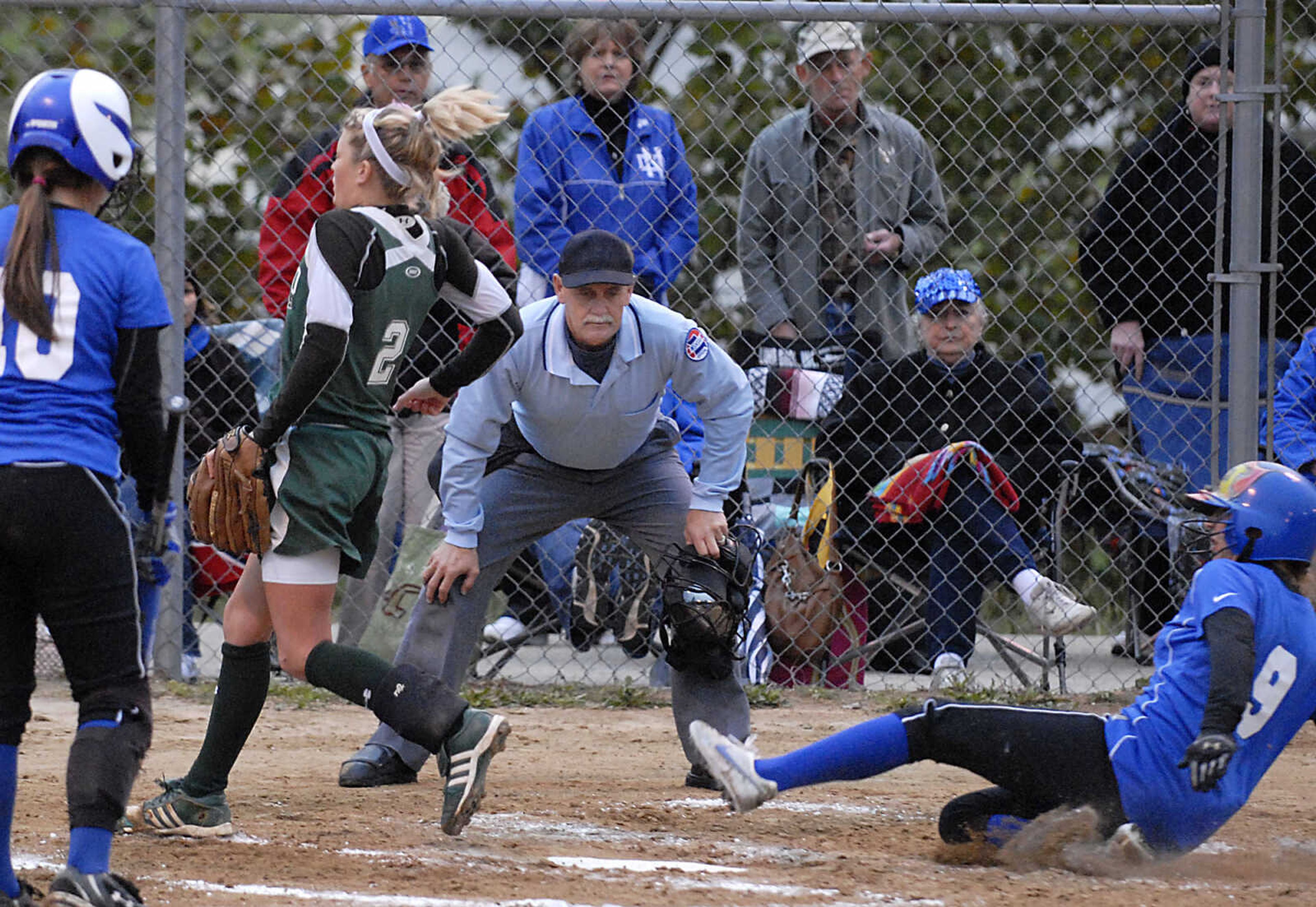 KIT DOYLE ~ kdoyle@semissourian.com
Notre Dame sophomore Hali Rengleman scores on a past ball as DeSoto pitcher Abby Roland tries to cover Thursday, October 15, 2009, in Poplar Bluff.