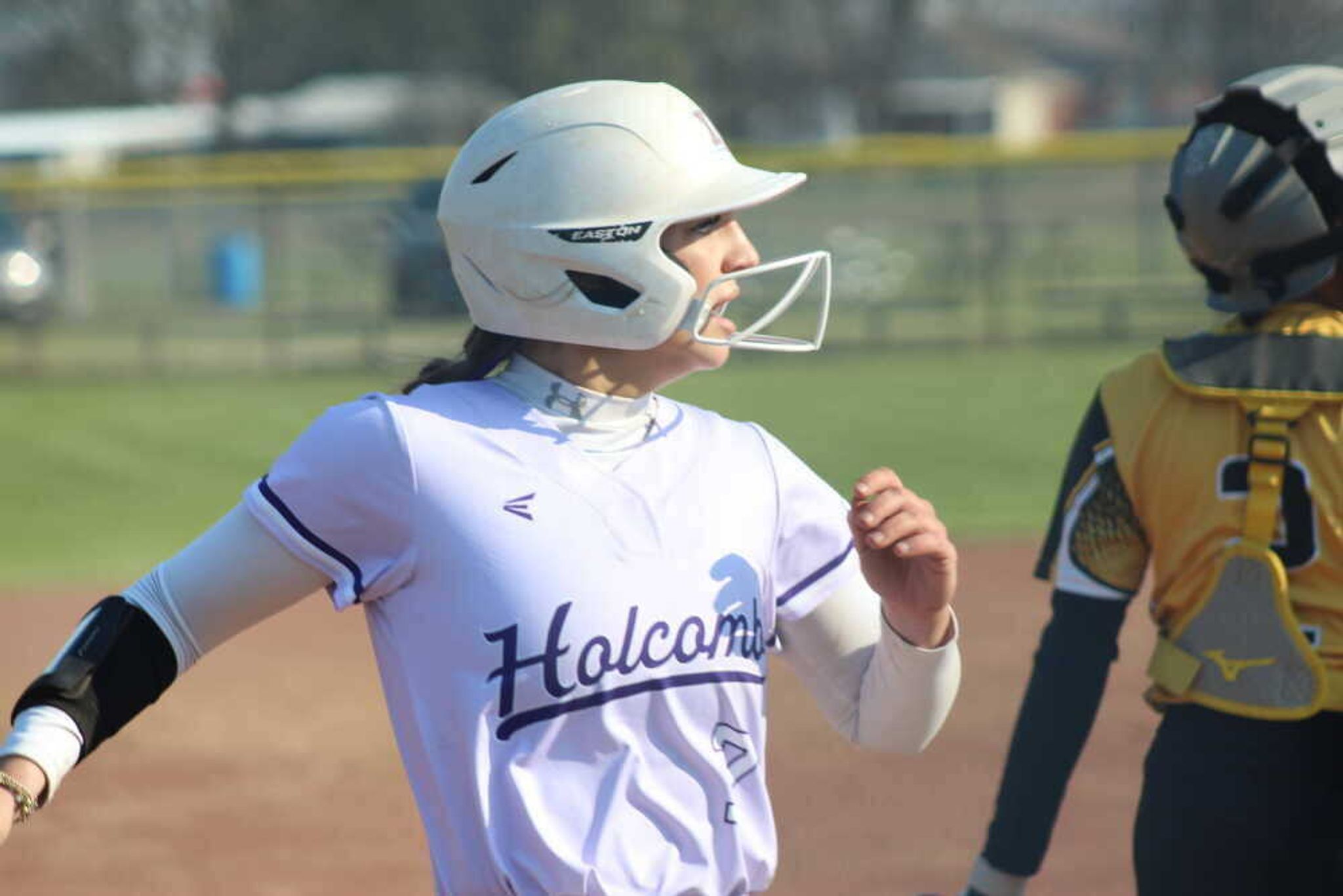 Holcomb Lady Hornet catcher Ella Jane Lemings strides home.