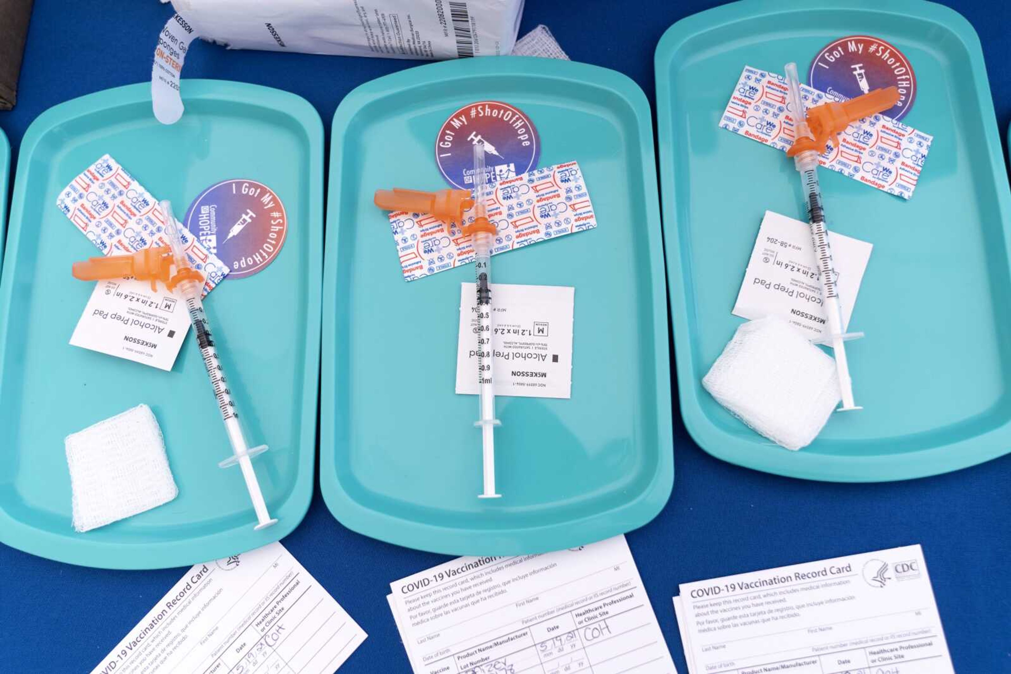 Pfizer COVID-19 vaccine doses are prepared for members of the community 12 years and older, at a clinic held by Community of Hope, outside the Washington School for Girls on May 19 in southeast Washington.