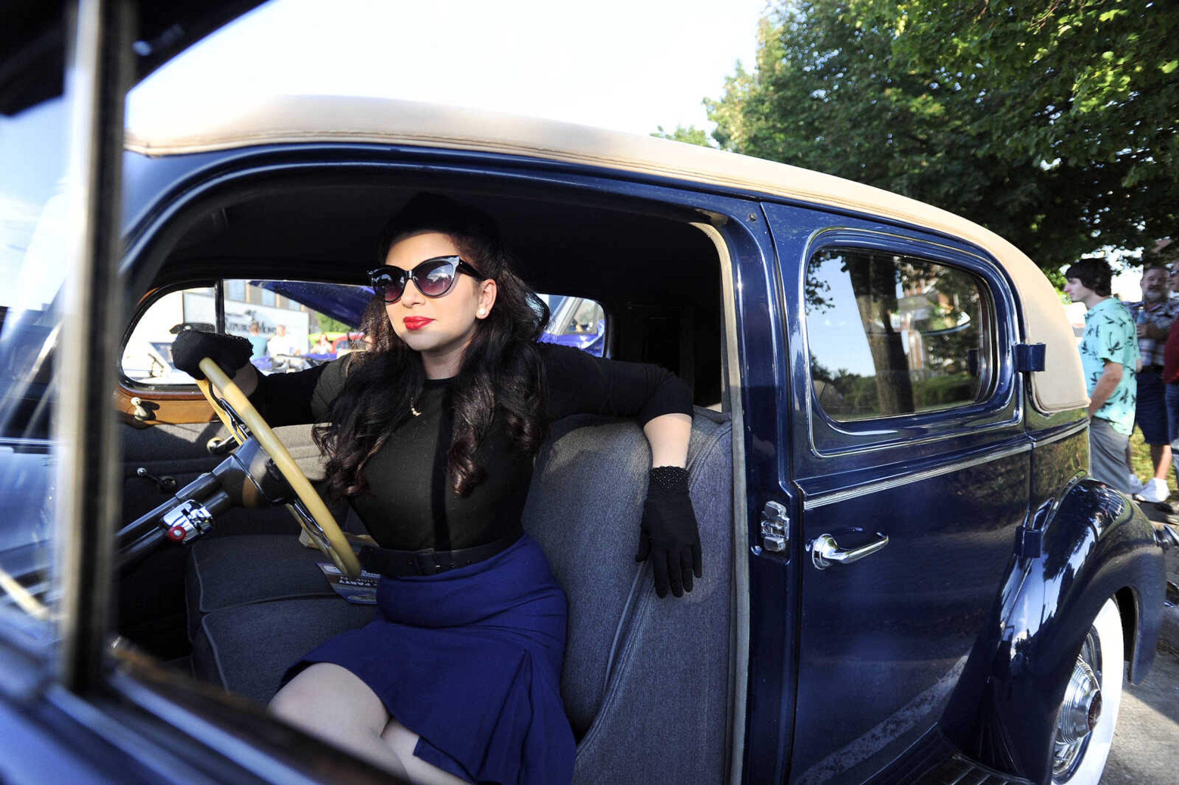 LAURA SIMON ~ lsimon@semissourian.com

Jona Edwards poses with a 1940 Packard 180 during the Perryville Pin-Up contest on Saturday, Sept 3, 2016, in Perryville, Missouri.