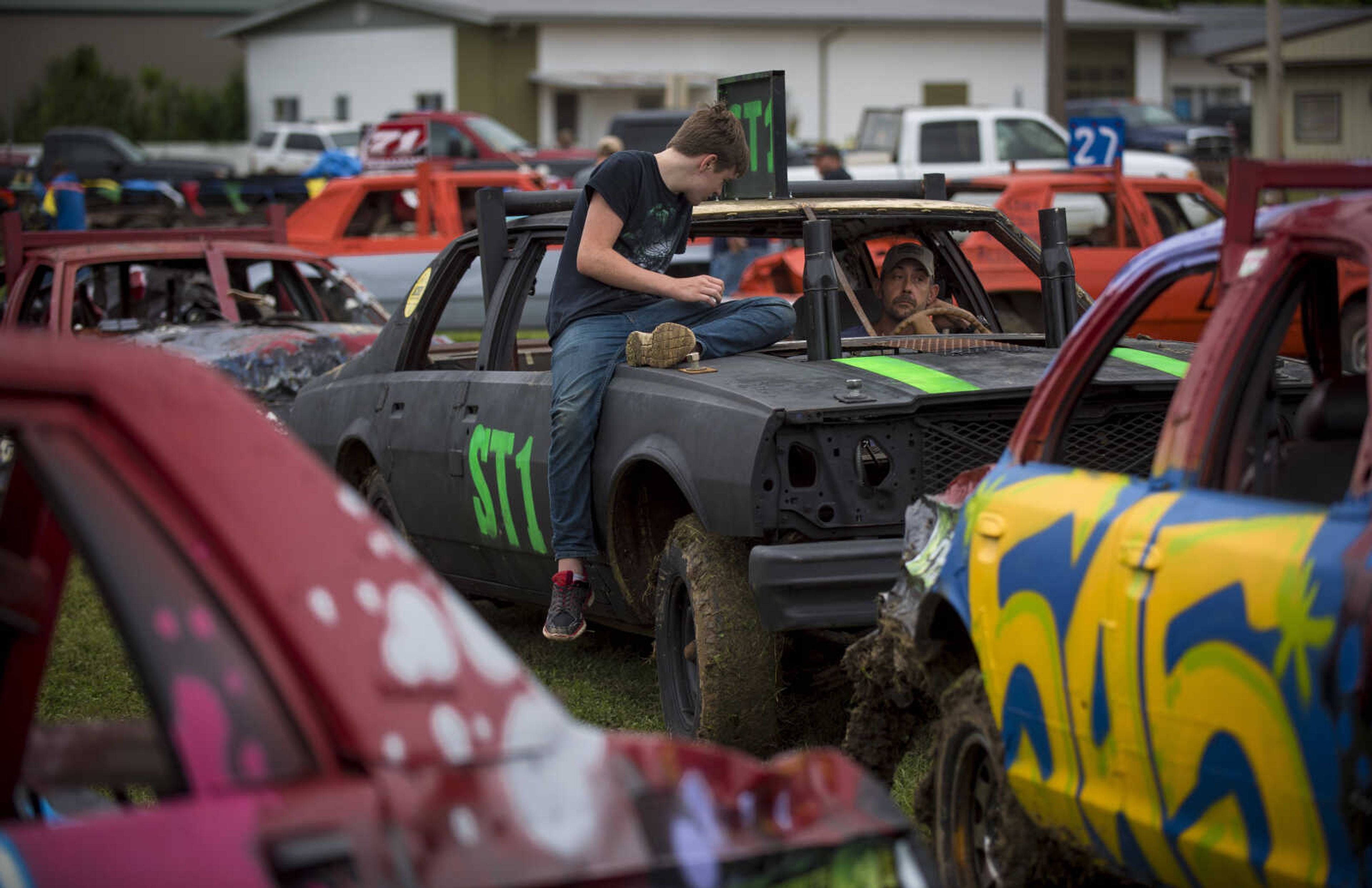 Drivers wait in line for inspection before the SEMO District Fair demolition derby Sunday.