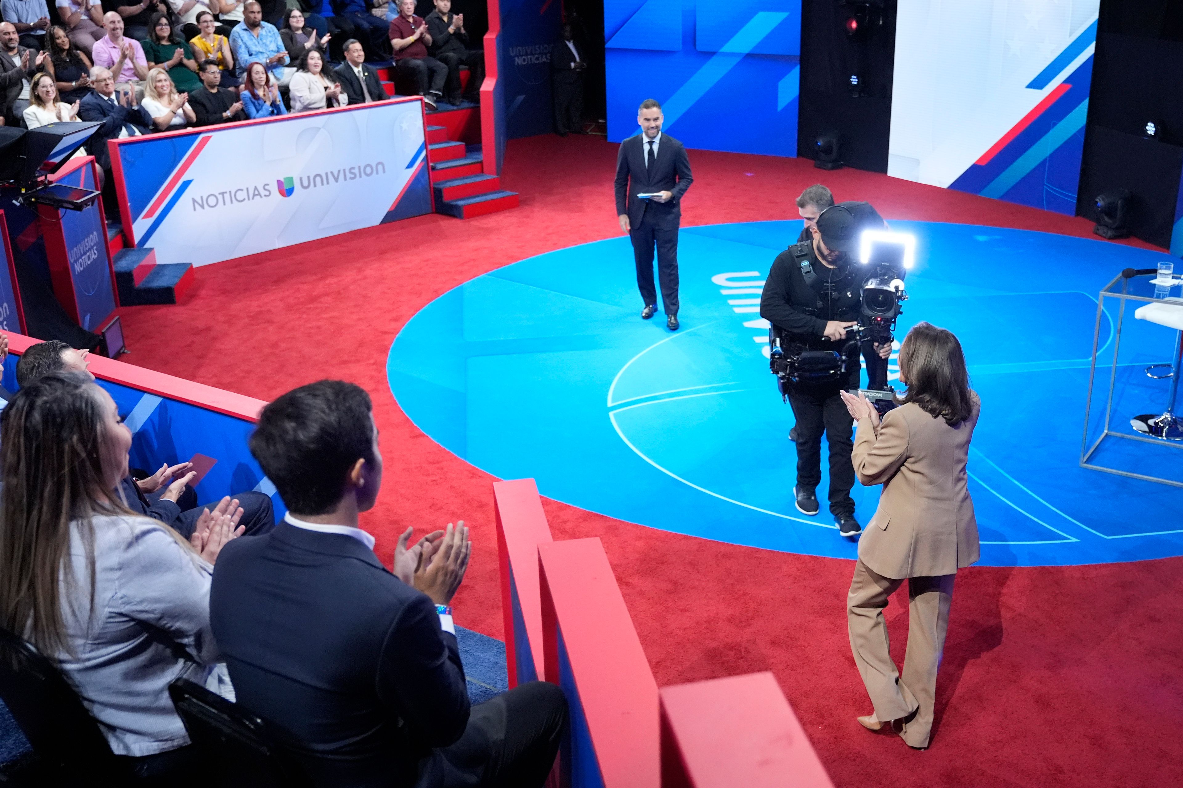 Democratic presidential nominee Vice President Kamala Harris, right, arrives at a Town Hall event hosted by Univision, Thursday, Oct. 10, 2024, at the University of Nevada Las Vegas. (AP Photo/Jacquelyn Martin)