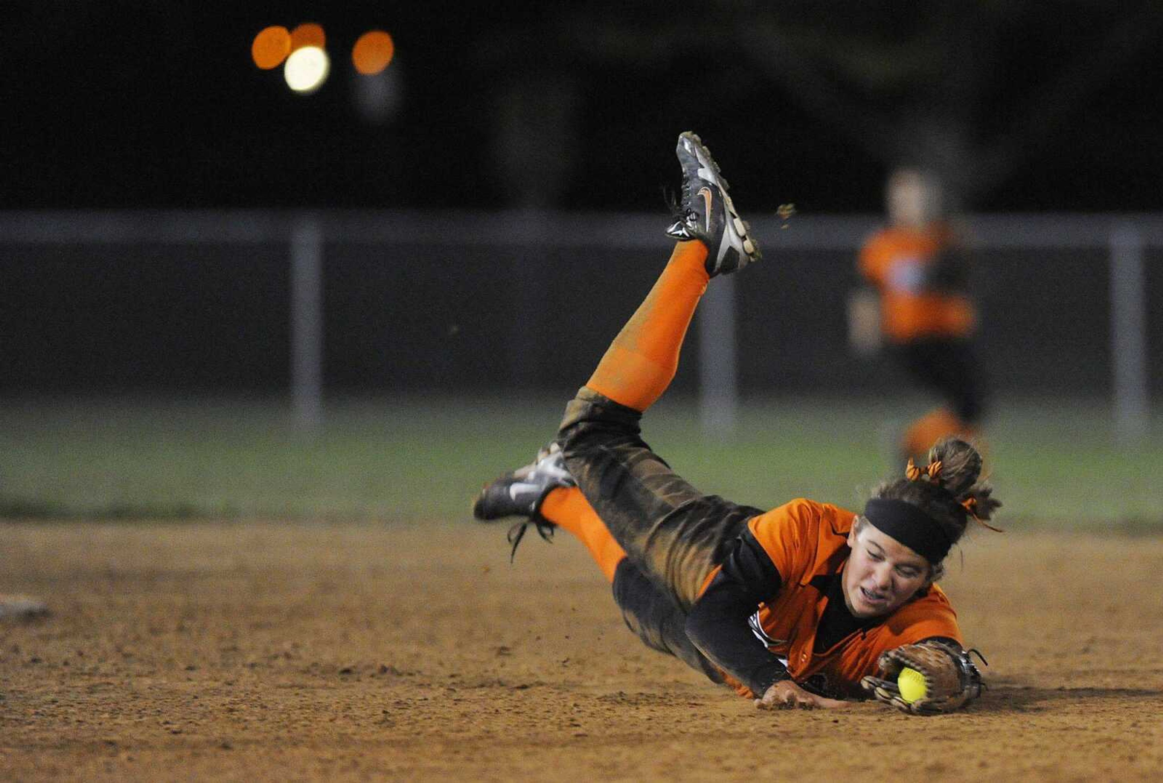 Central second baseman Bailey Kratochvil dives for a ground ball in the second inning Wednesday at Jackson City Park. (ADAM VOGLER)