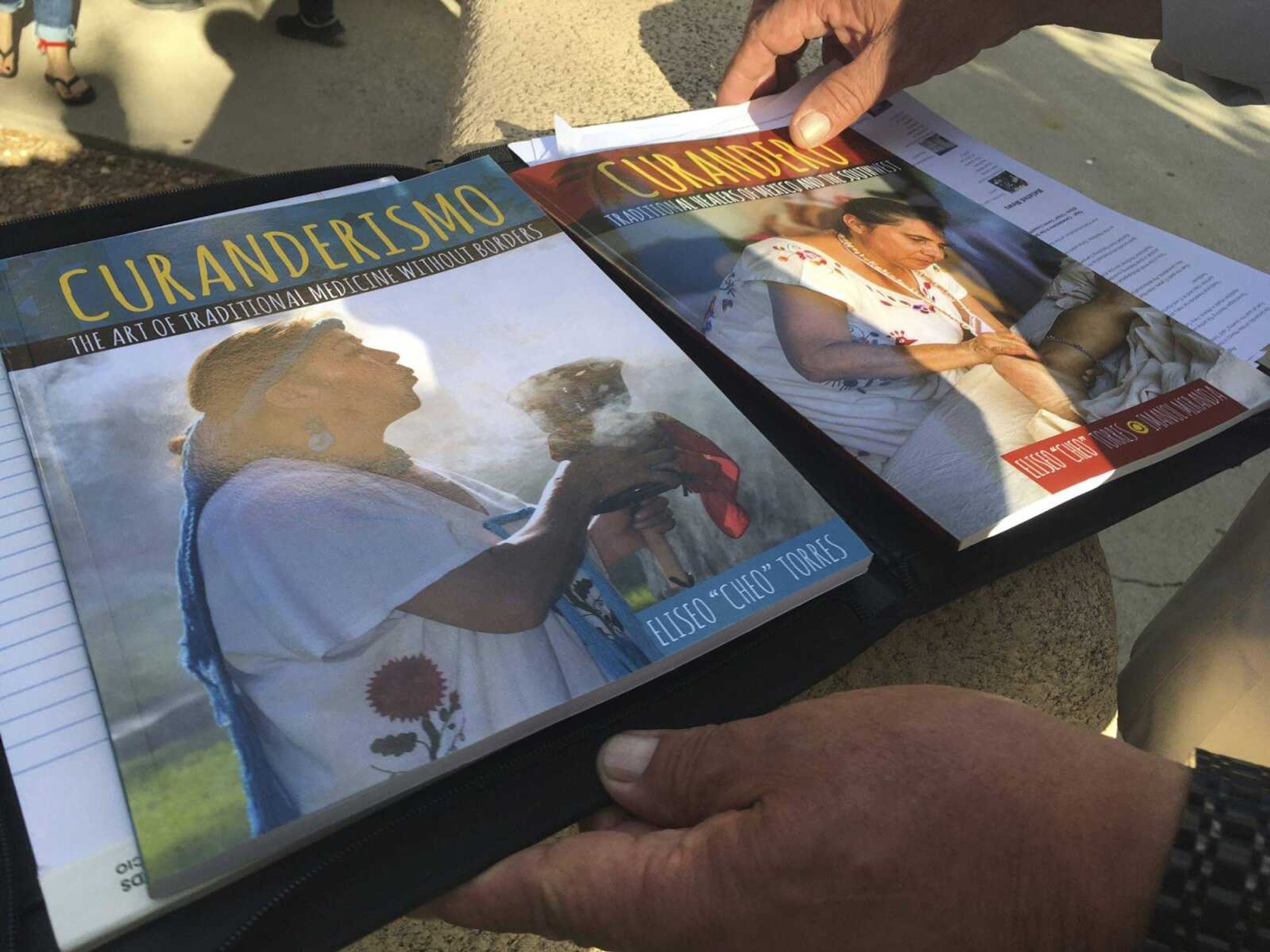 A new textbook on indigenous healing is shown Monday  at the University of New Mexico in Albuquerque during the school's annual course on Curanderismo indigenous healing methods from the American Southwest and Latin America.