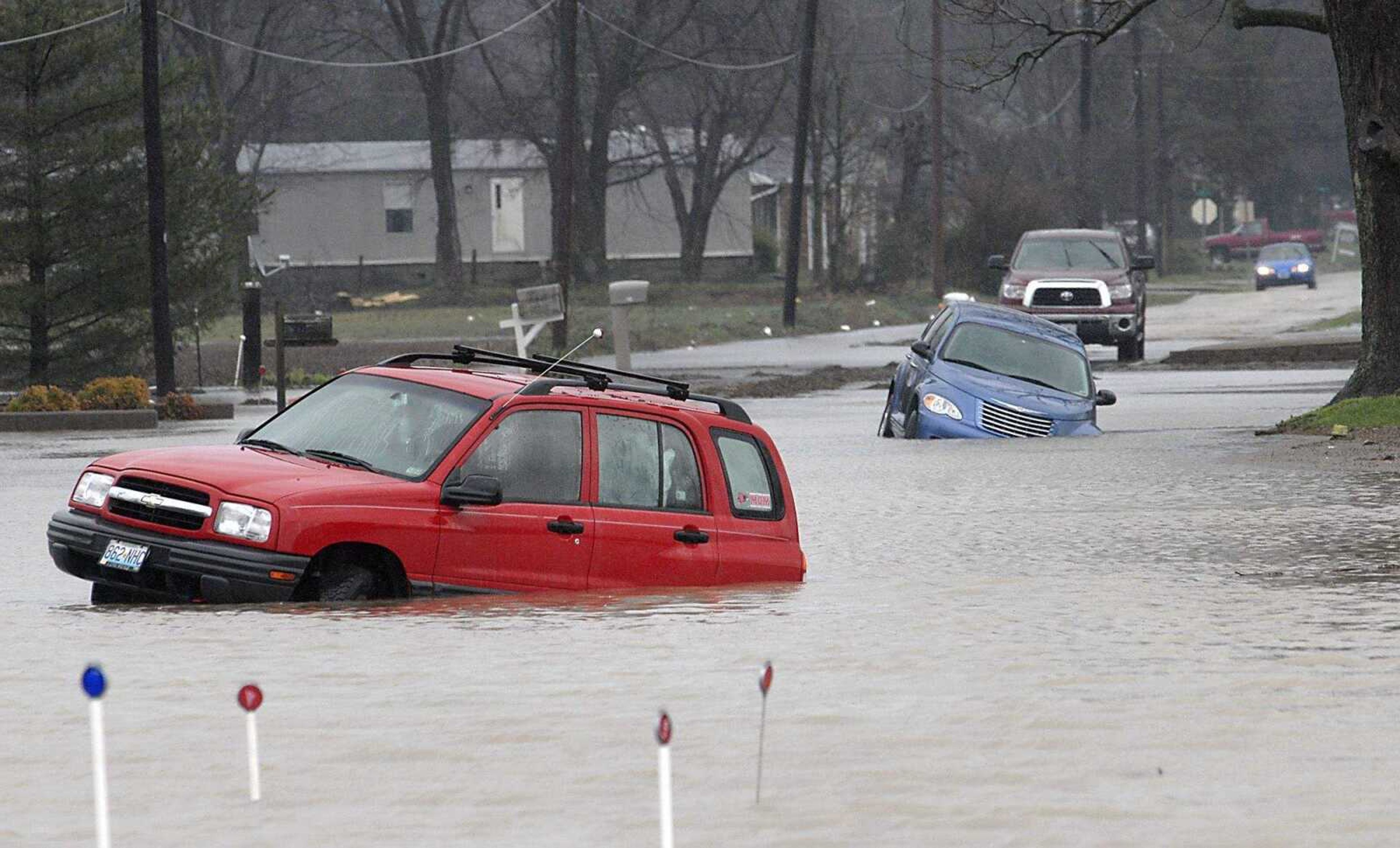 FRED LYNCH ~ flynch@semissourian.com
Floodwaters covered Helen Street in Chaffee Wednesday afternoon where two vehicles were stranded near the intersection with Highway 77.