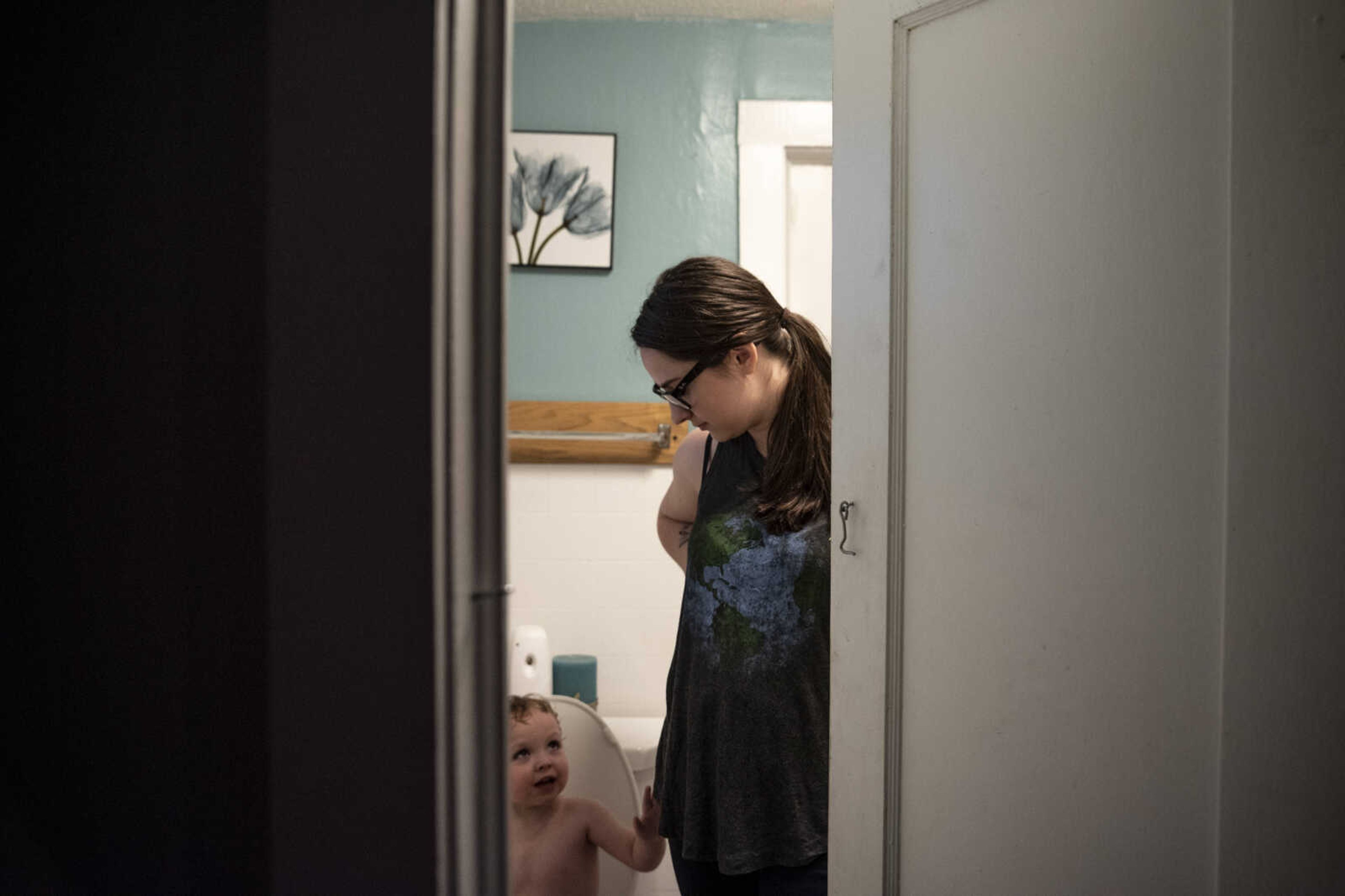 Emily Medlock supervises her son, Phoenix Young, 2, as she works on potty-training him at home before putting him to bed Tuesday, May 7, 2019, in Cape Girardeau.