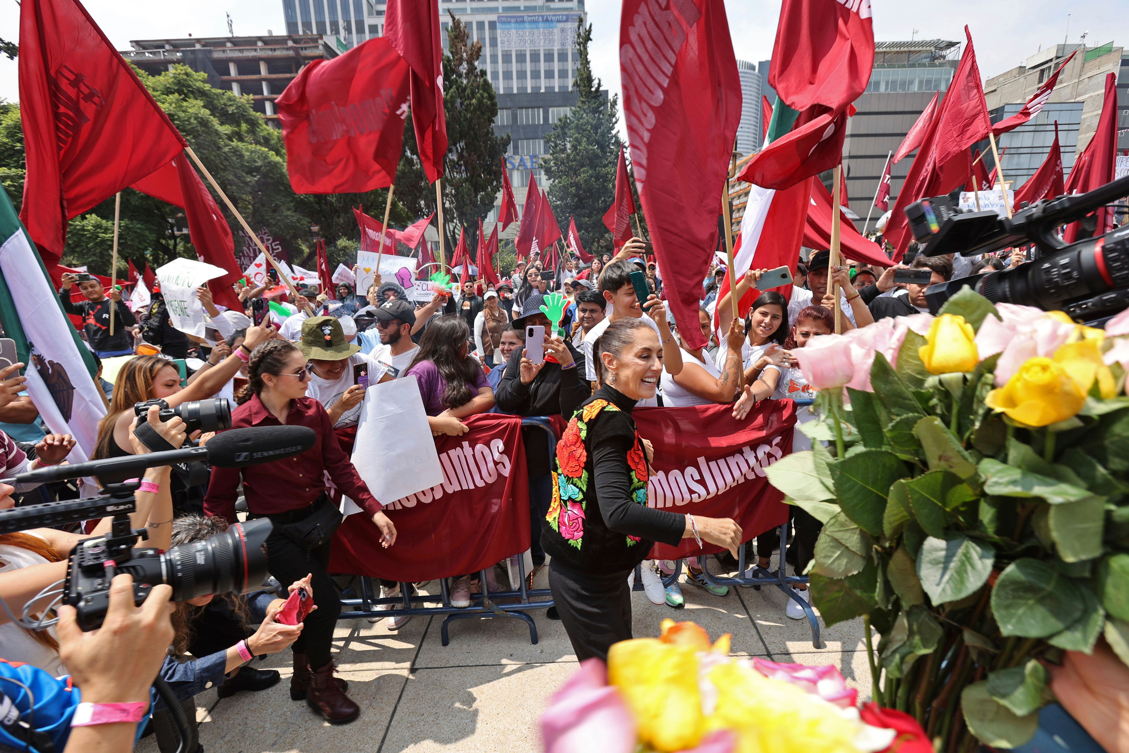 FILE - Former Mayor Claudia Sheinbaum greets supporters during a closing campaign rally for her presidential candidate bid to represent the ruling MORENA party, in Mexico City, Aug. 26, 2023. (AP Photo/Ginnette Riquelme, File)