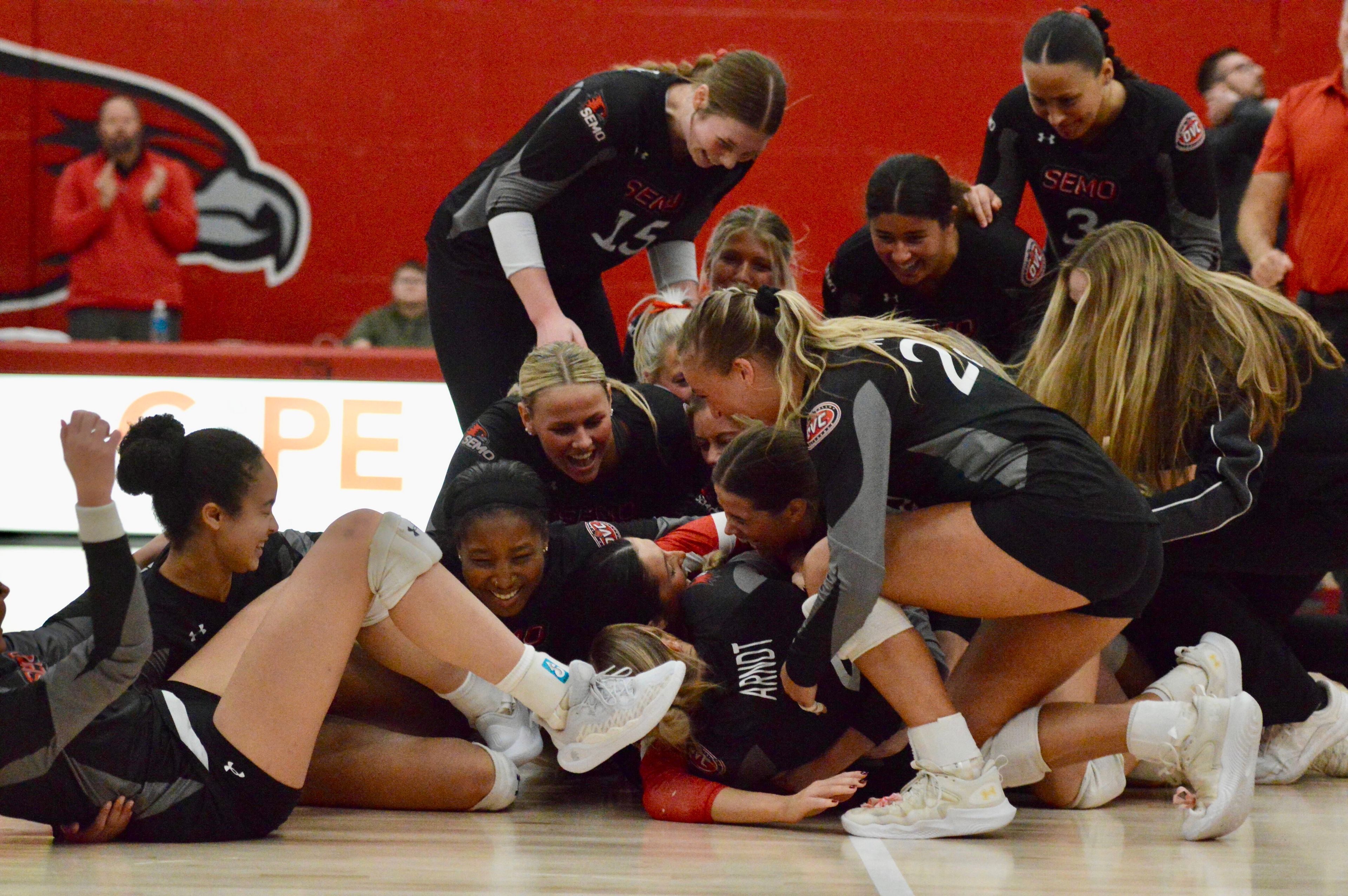 The SEMO volleyball team dogpiles on the court to celebrate their OVC Regular Season Championship on Wednesday, Nov. 20, at Houck Field House.