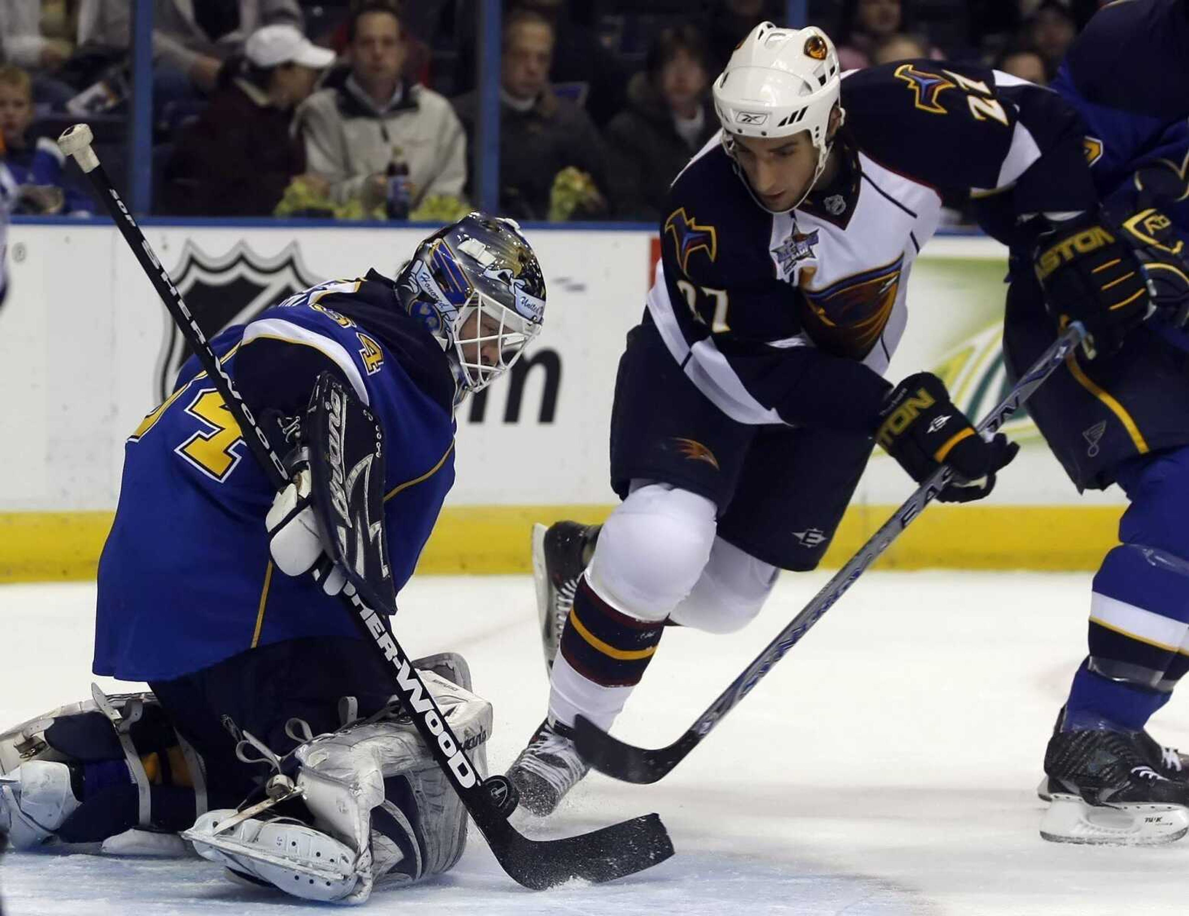 Blues goalie Manny Legace stopped a shot by Atlanta's Chris Thorburn during the first period Sunday in St. Louis. (TOM GANNAM ~ Associated Press)