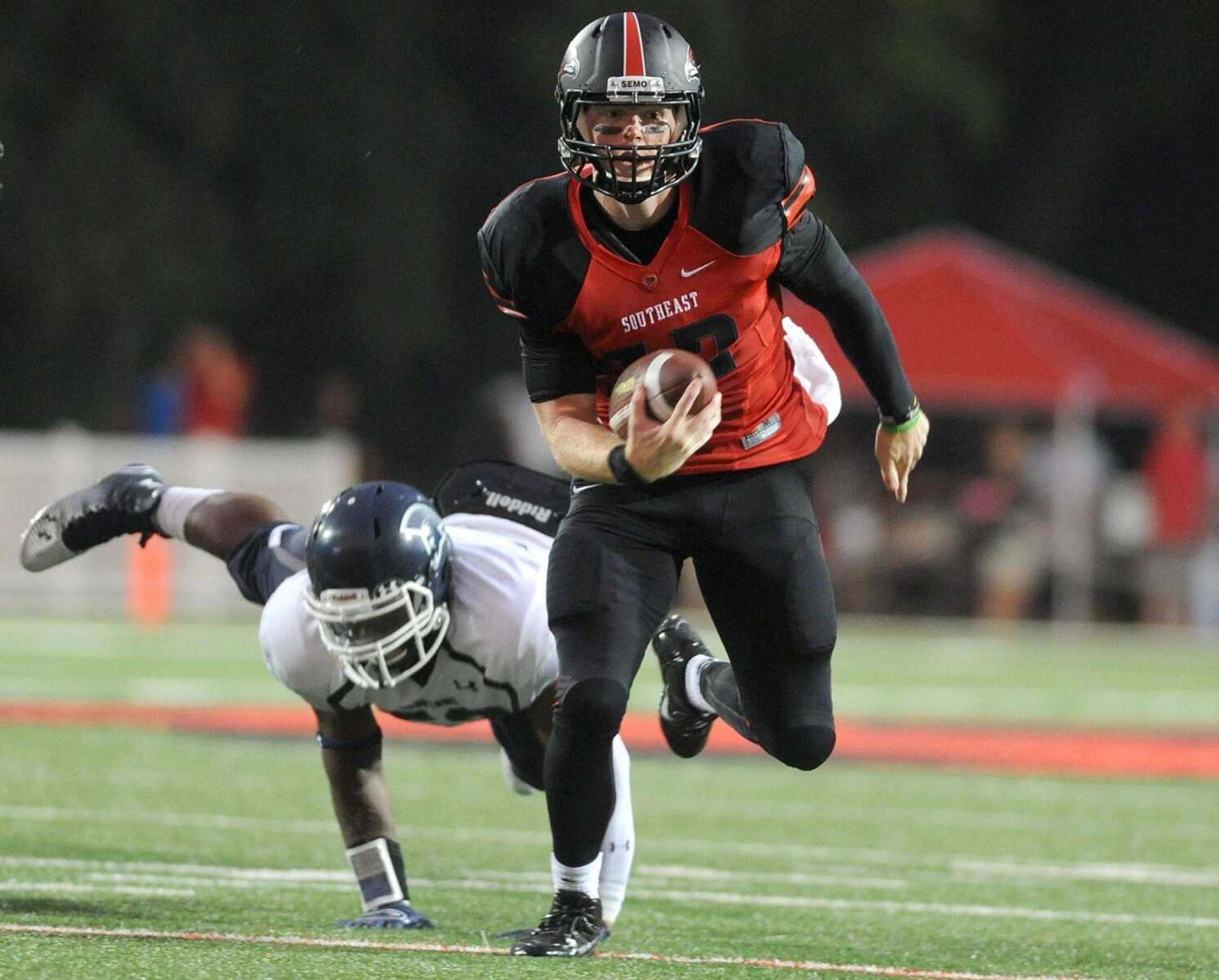 Southeast Missouri State's Kyle Snyder outruns a Missouri Baptist player during the seasons first game Thursday, Aug. 28, 2014 at Houck Stadium. (GLENN LANDBERG)