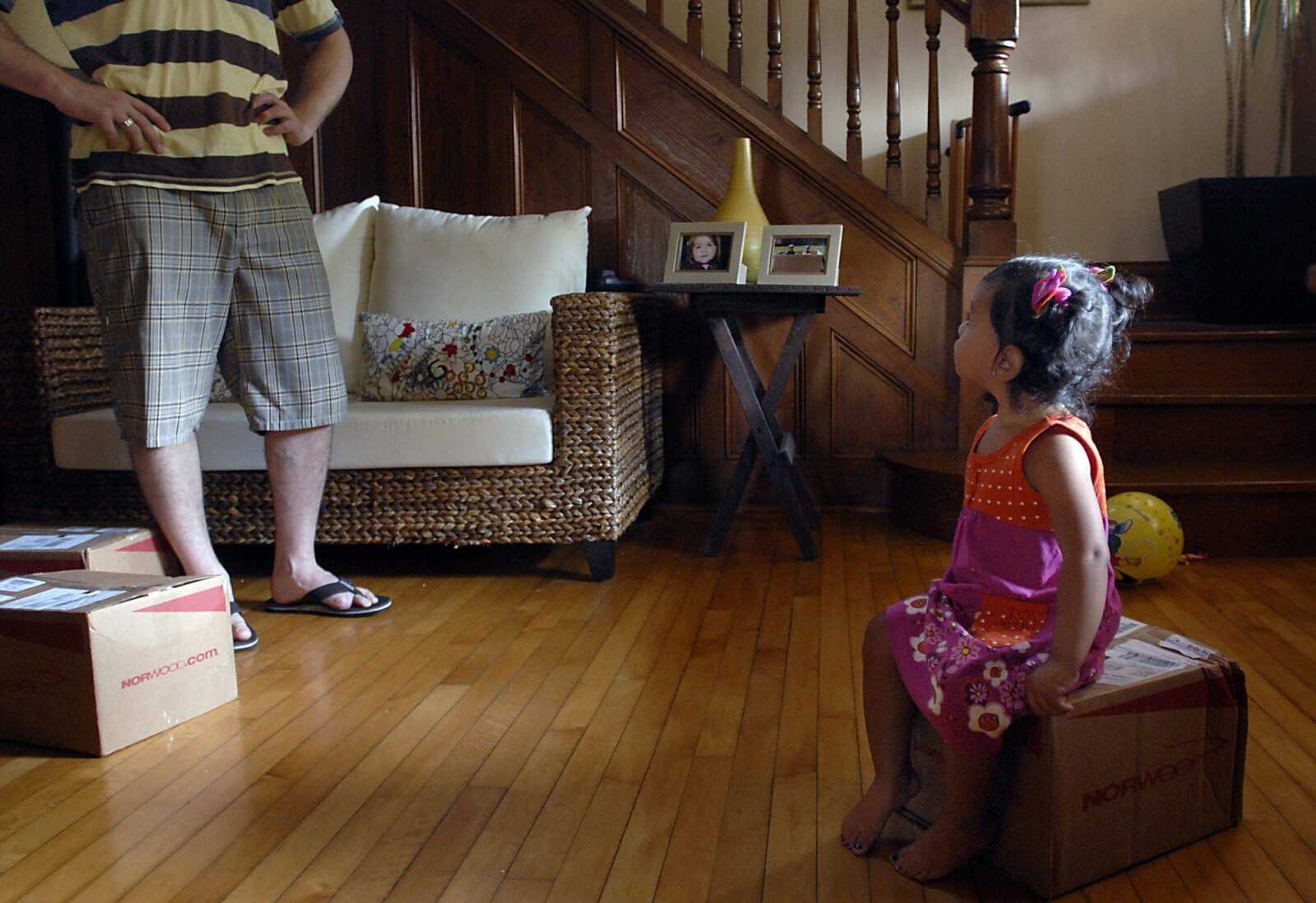 KIT DOYLE ~ kdoyle@semissourian.com
Bianca Becking listened to her father Eric Thursday morning, August 21, 2008, while taking a break from playing with boxes. Bianca, almost two, still remembers aspects of Guatemala, where they adopted her, such as cheering when a goal is scored in soccer.