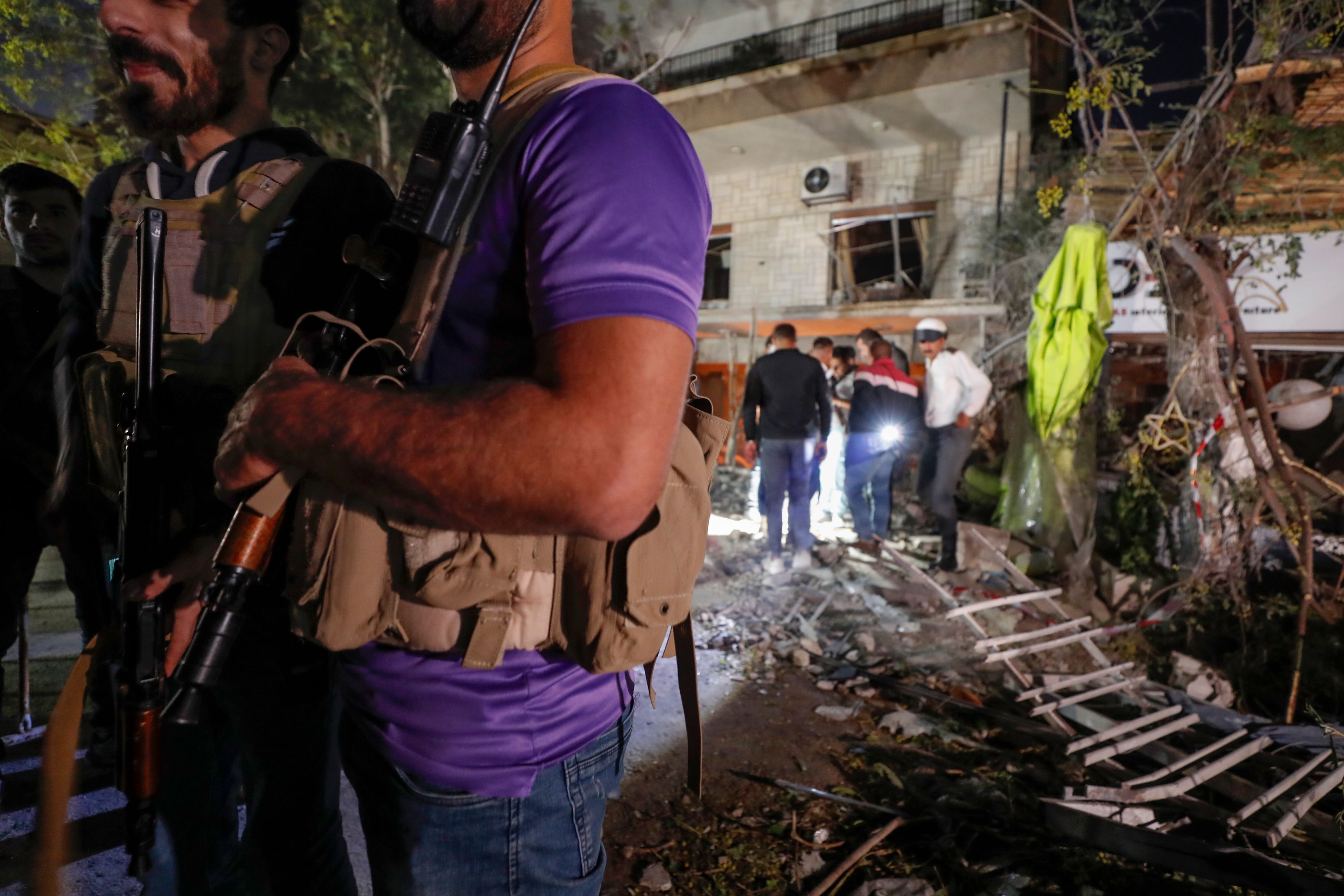 Police stand guard at the site of an apparent Israeli airstrike in Damascus, Syria, Wednesday, Oct. 2, 2024. (AP Photo/Omar Sanadiki)