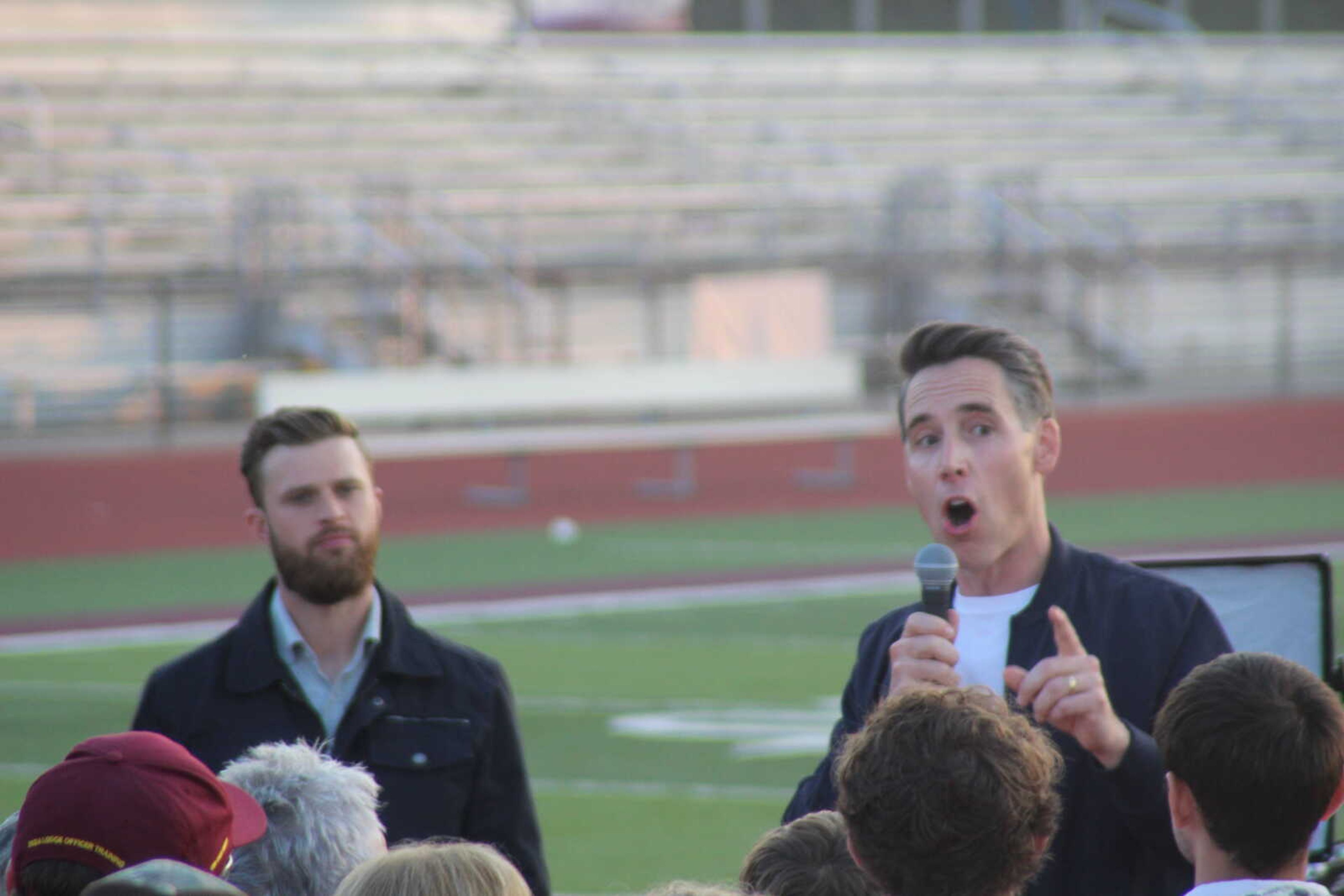 Sen. Josh Hawley, R-Mo., right, speaks during a campaign event alongside Kansas City Chiefs kicker Harrison Butker on Thursday, Oct. 10, in Poplar Bluff.