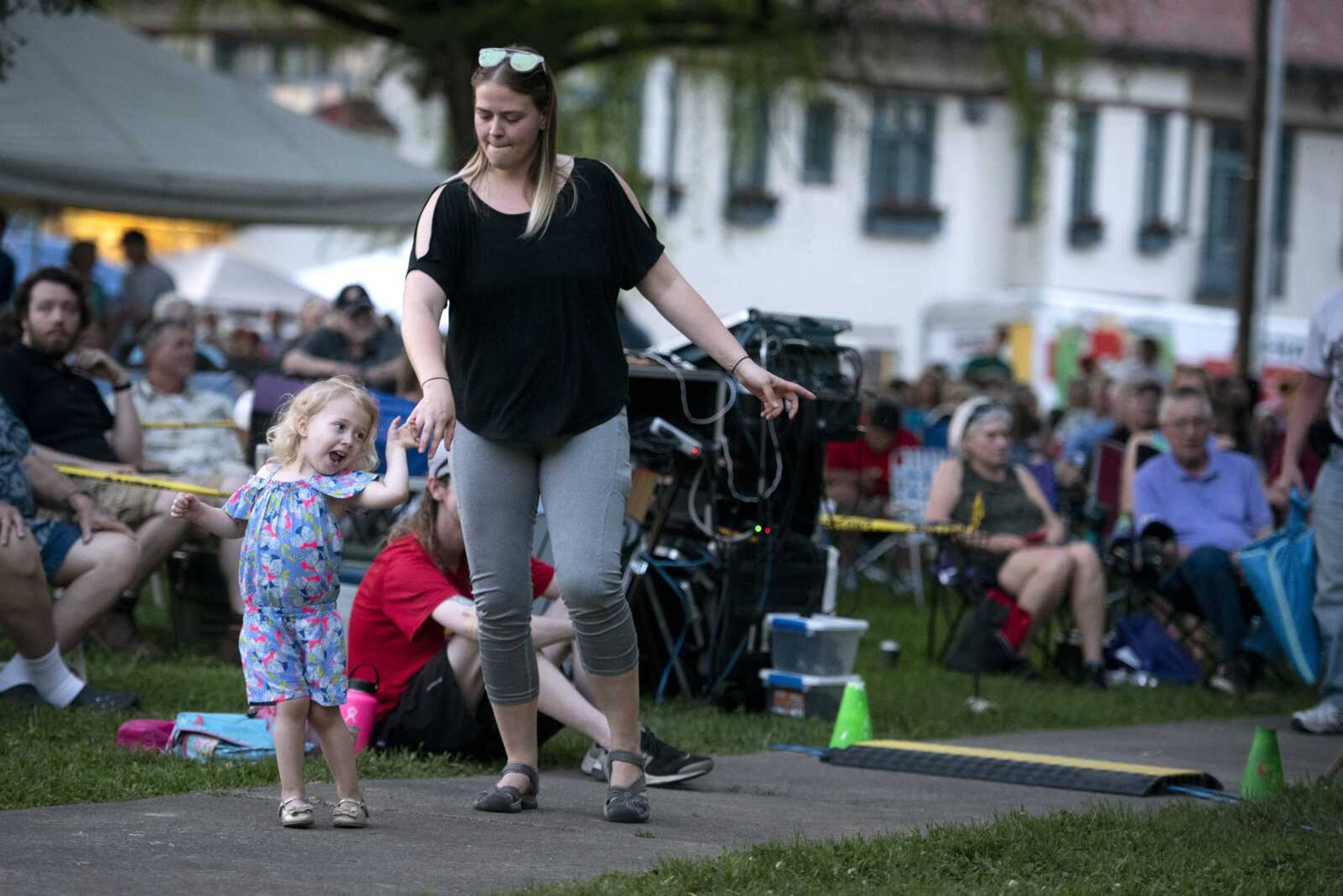 Lydia Wade of Jackson dances with her daughter Ede Wade, 3, to the music of Paul Childers on May 17 during Tunes at Twilight at Ivers Square in downtown Cape Girardeau.