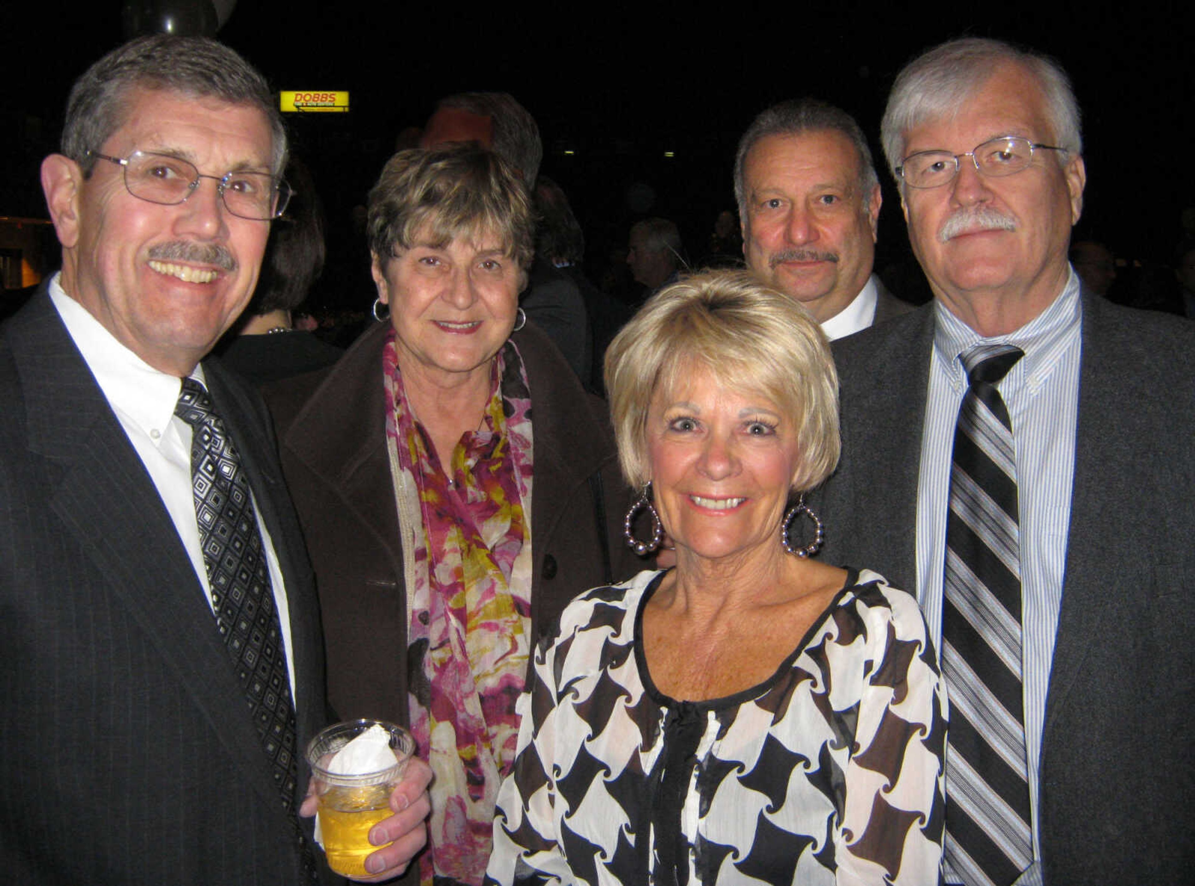 Bob Herbst, left, Prudential Bridgeport; Rose Meister, Prudential Alliance; Michael Carrafiello, Isle of Capri; Cherie Herbst, and Dick Meister, Isle of Capri, pose at the Cape Girardeau Area Chamber of Commerce annual banquet Friday, Jan. 27 at the Show Me Center.