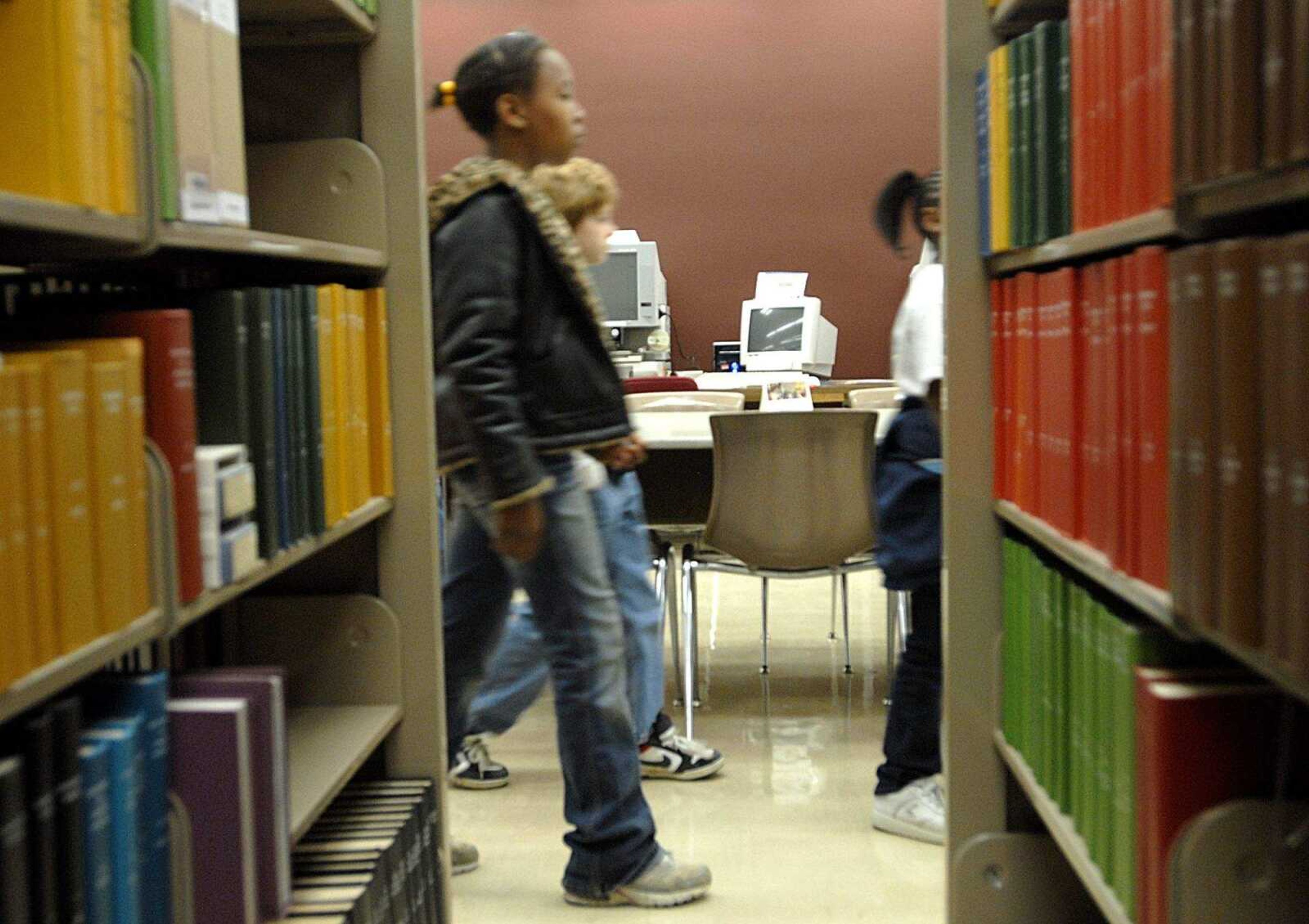 AARON EISENHAUER ~ aeisenhauer@semissourian.com
Jefferson Elementary students make their way past stacks of reference books in Kent library during their tour of the Southeast Missouri State University campus on Wednesday, April 16, 2008.