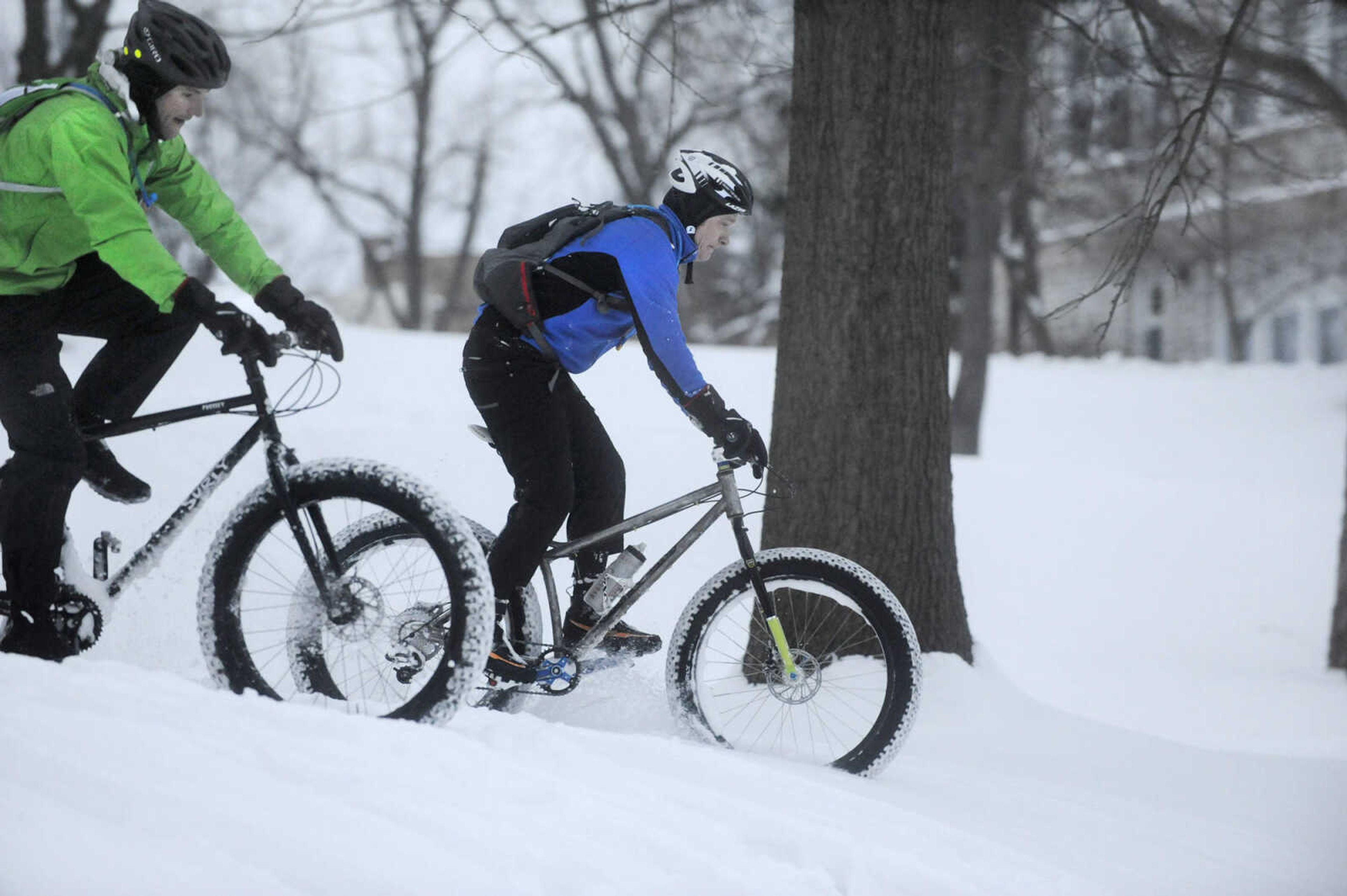 LAURA SIMON ~ lsimon@semissourian.com

John Dodd, right, and Tim Vollink ride fat bikes through the snow on the terraces outside Academic Hall Tuesday evening, Feb. 17, 2015.