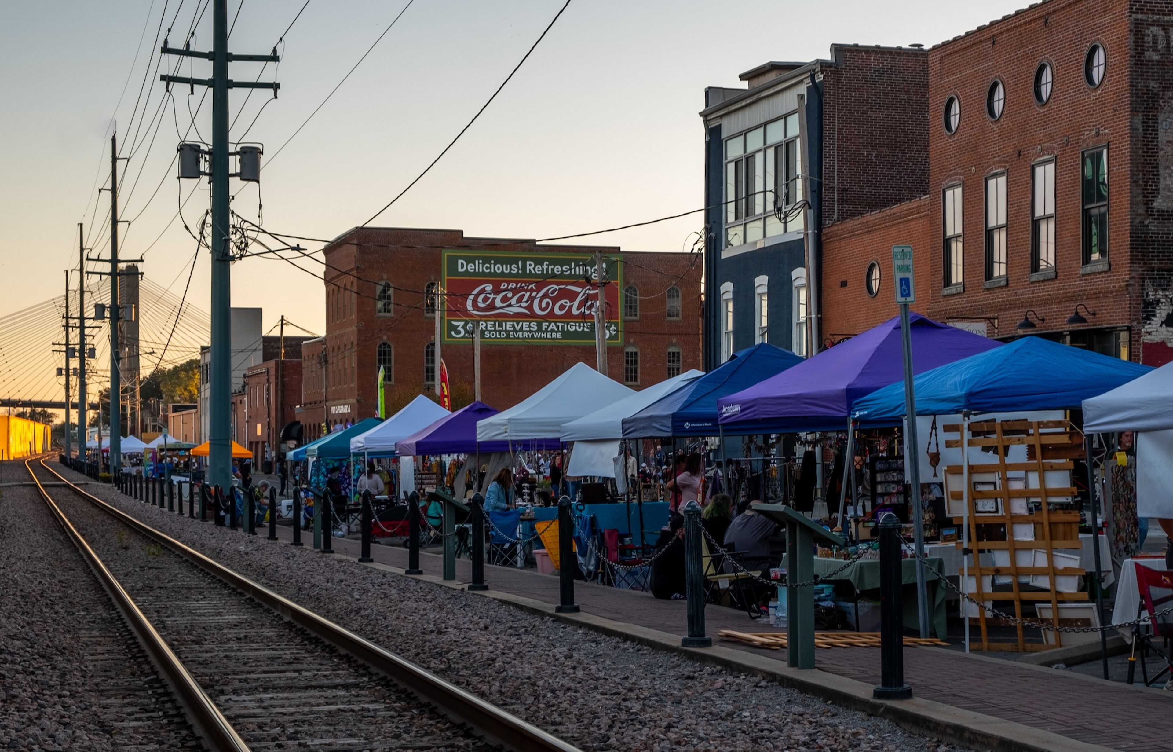 Now in its third year, the Riverfront Fall Festival highlights a restored Coca-Cola mural by Craig Thomas, as local businesses set up stands along the railroad track in downtown Cape Girardeau.