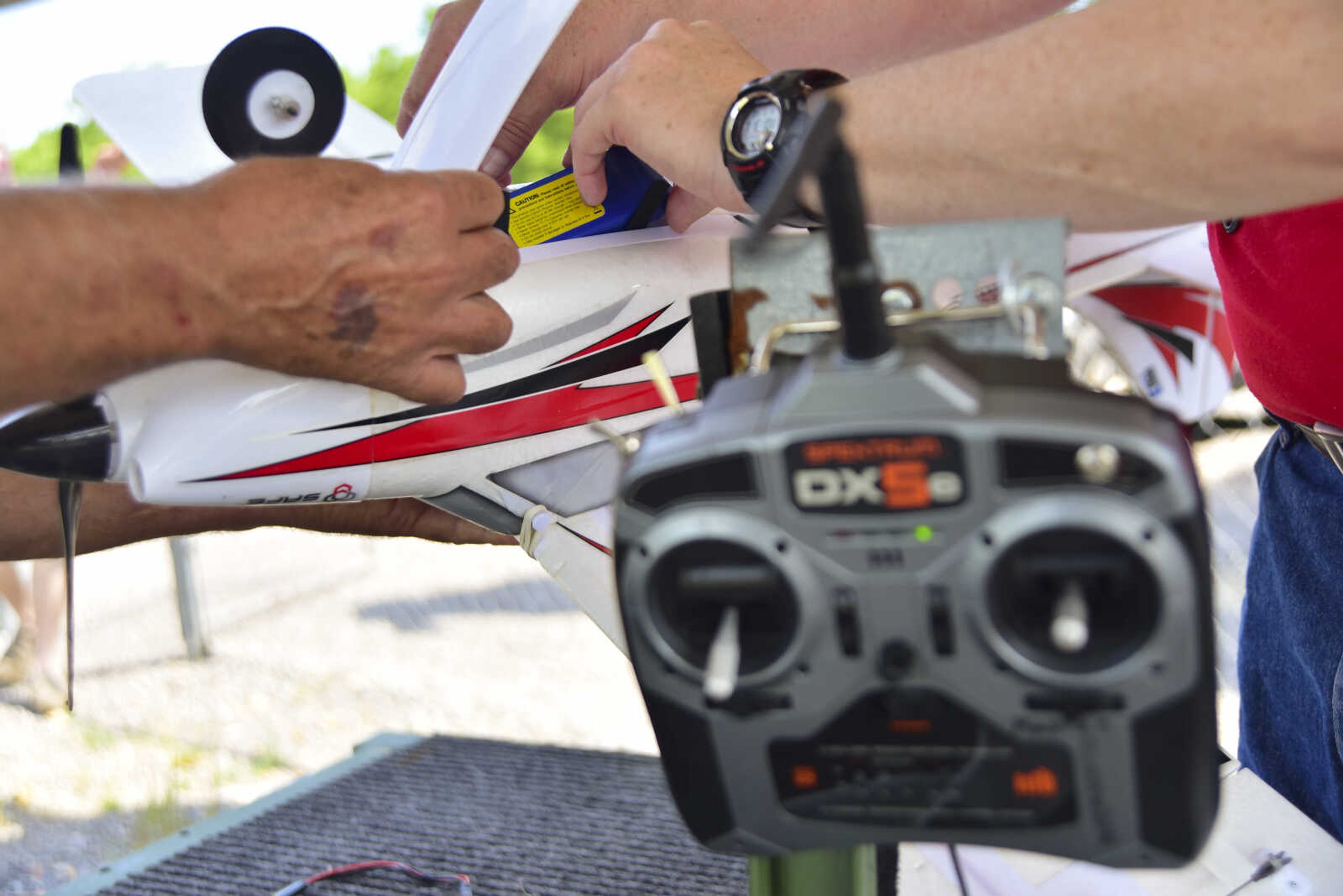 Mark McCoy (not pictured) prepares his airplane for the Cape Fly Hi radio controlled aircraft demonstration Saturday, June 3, 2017 at Galaxy Park in Cape Girardeau.